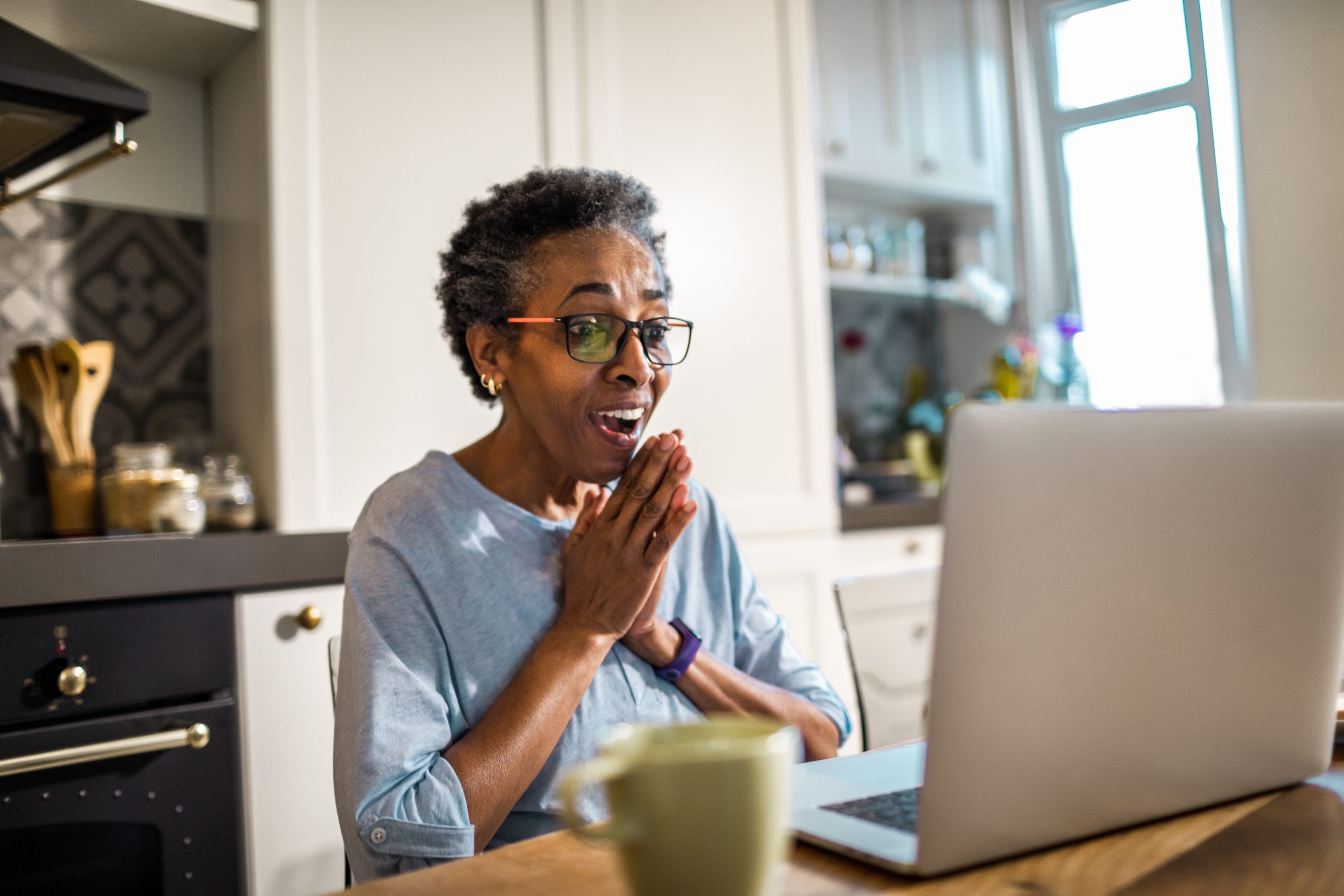 A senior uses a laptop