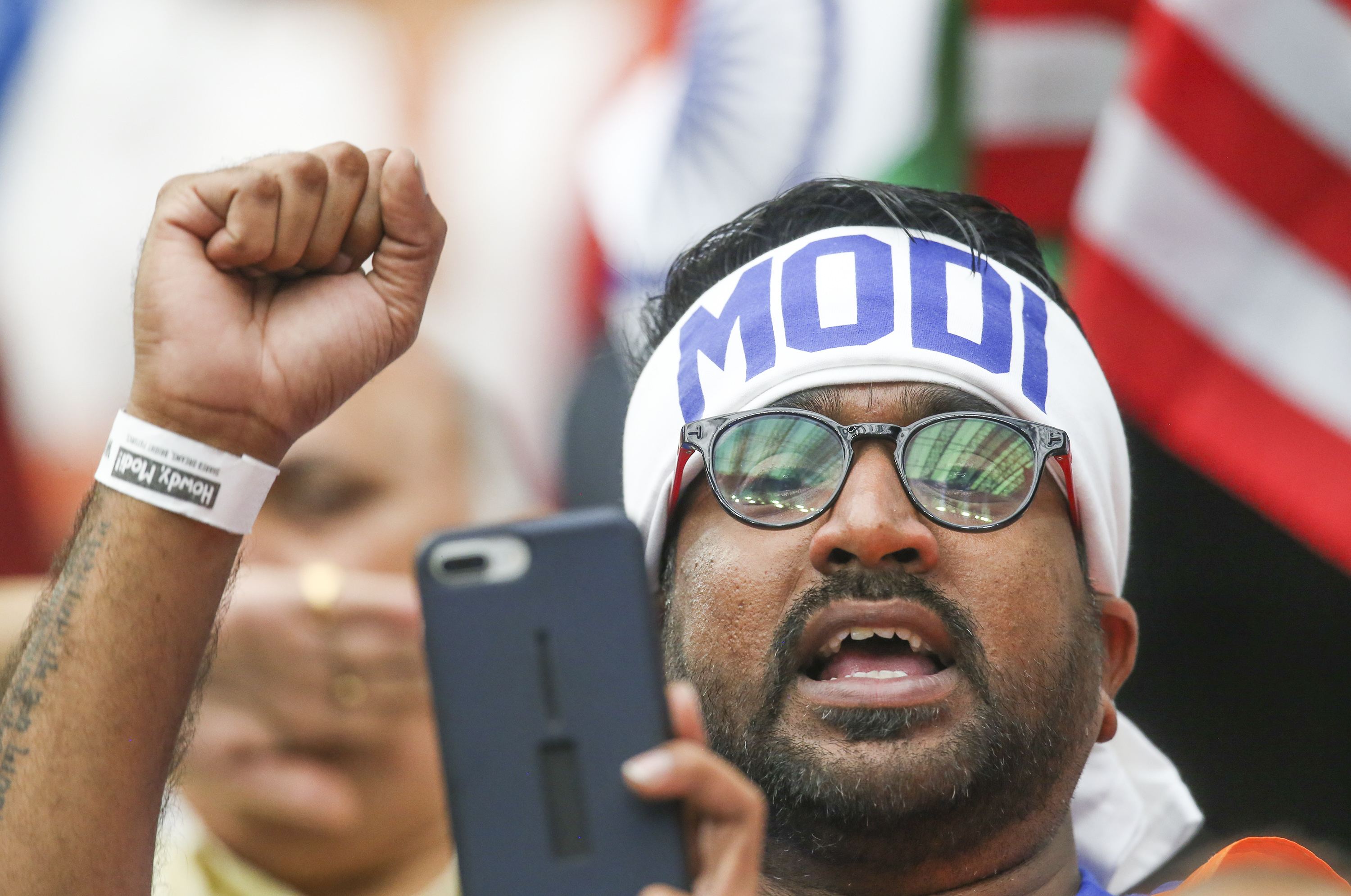 An audience member cheers Indian Prime Minister Narendra Modi