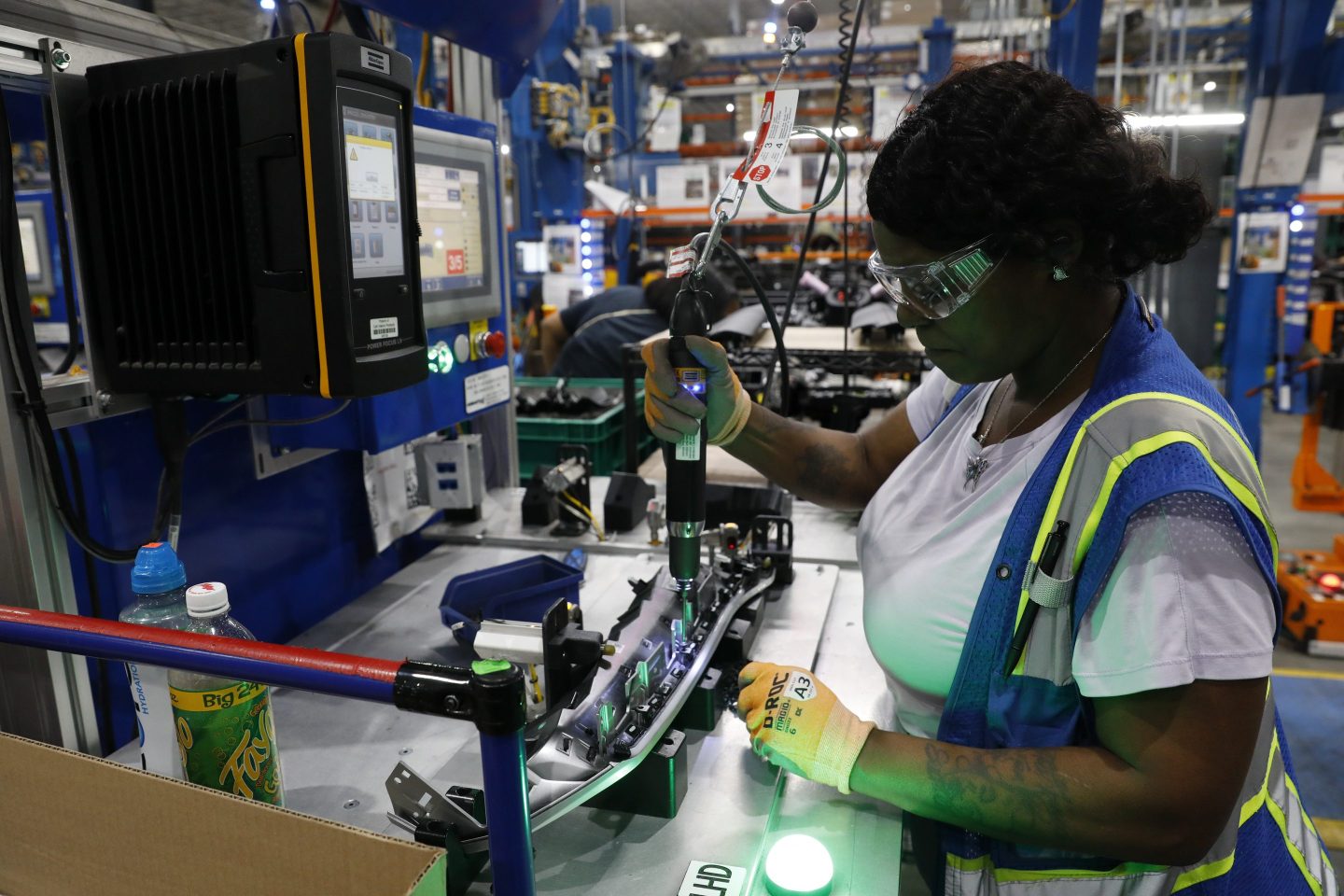 An employee works in a manufacturing facility.