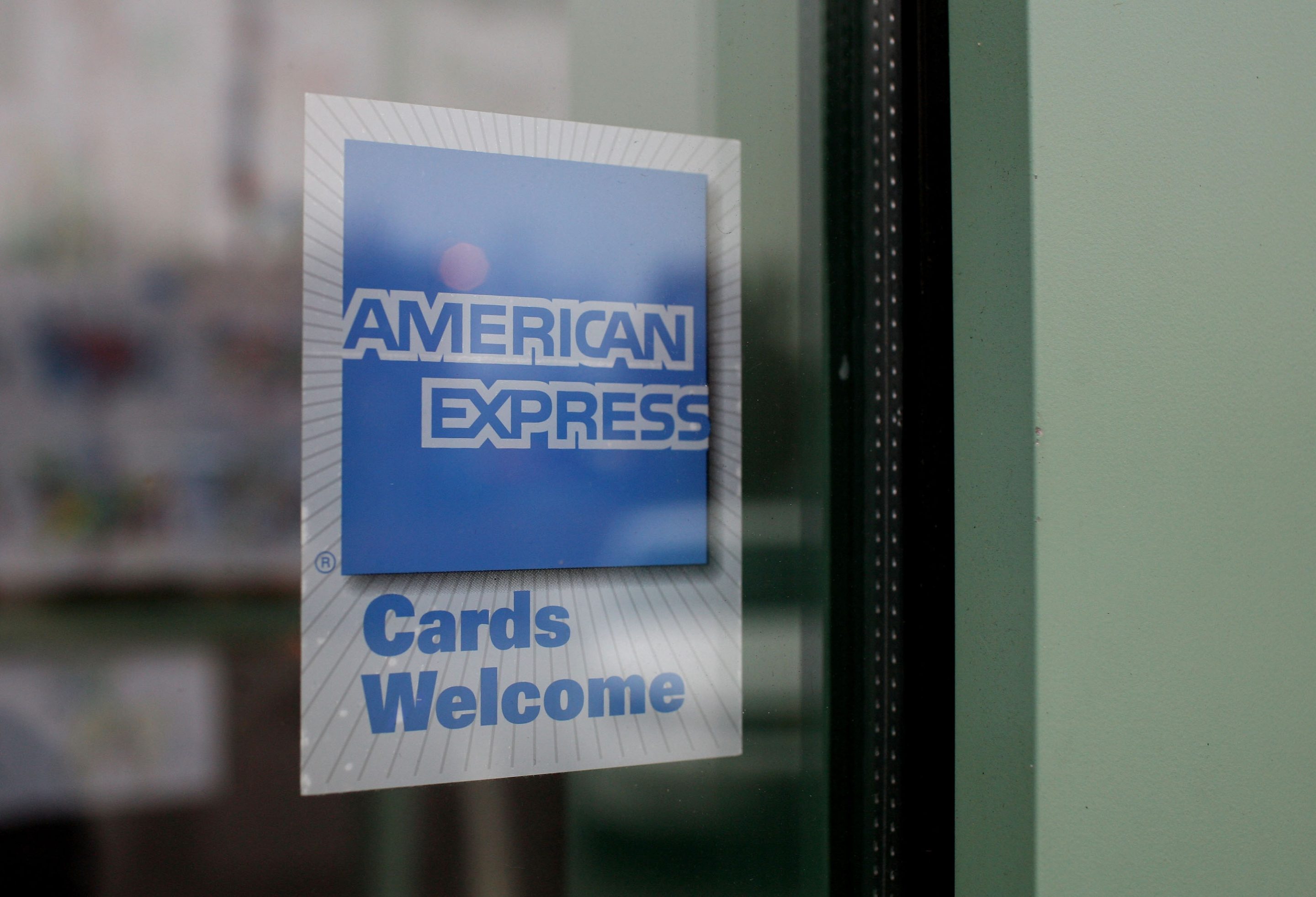 A sign showing the American Express logo is seen outside of a restaurant November 11, 2008 in Des Plaines, Illinois.