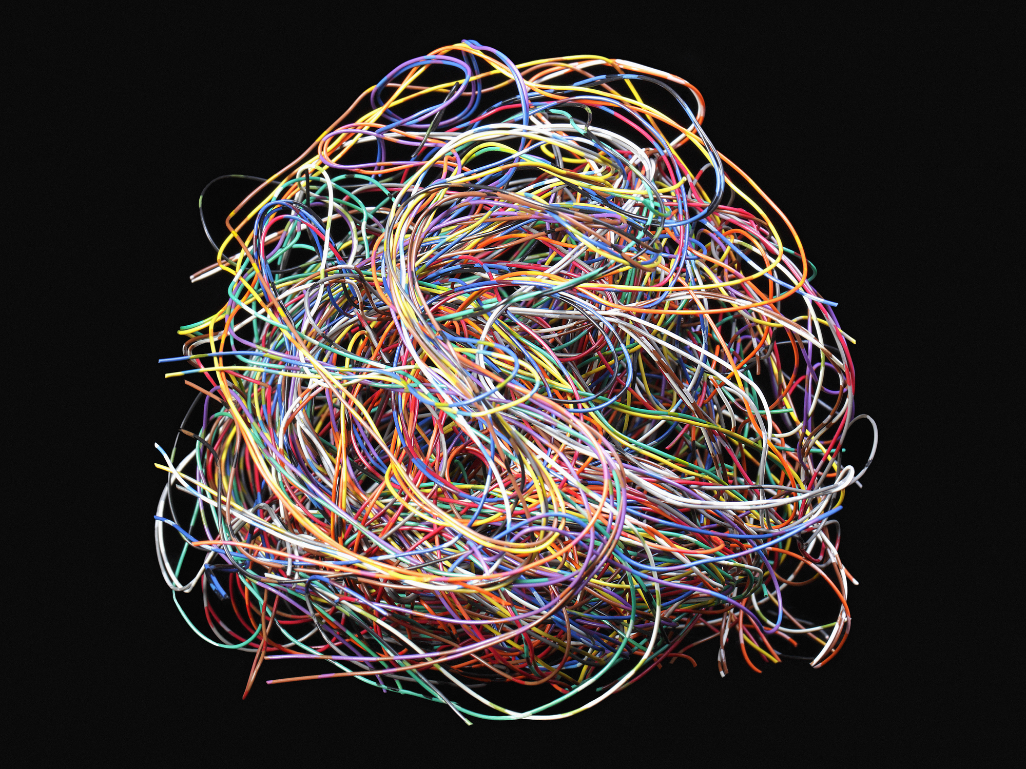 Tangled ball of colored wires against black