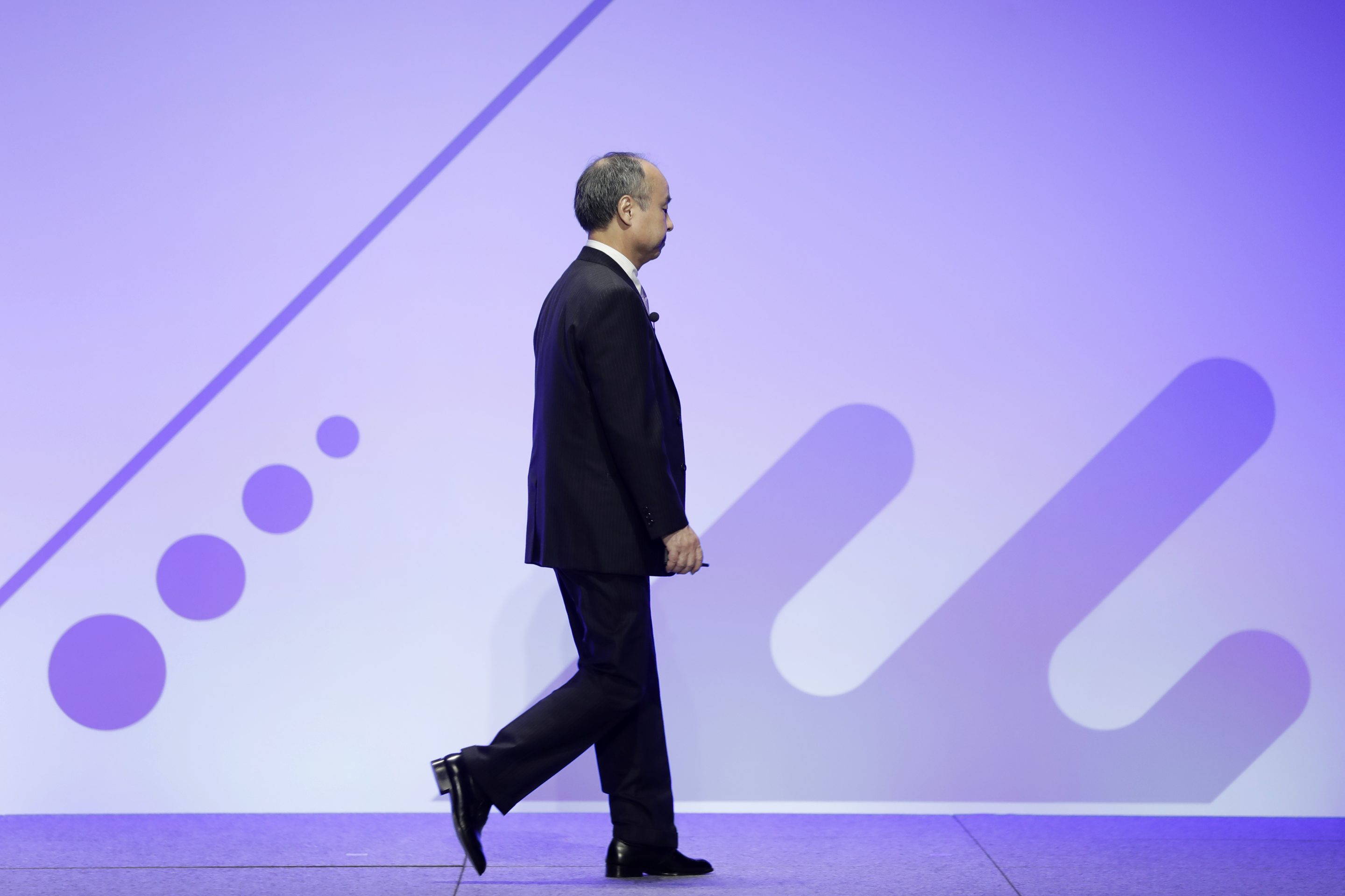 Masayoshi Son, chairman and chief executive officer of SoftBank Group Corp., leaves after he delivered a keynote speech at the Junior Chamber International (JCI) World Congress in Yokohama, Japan, on Nov. 4, 2020.