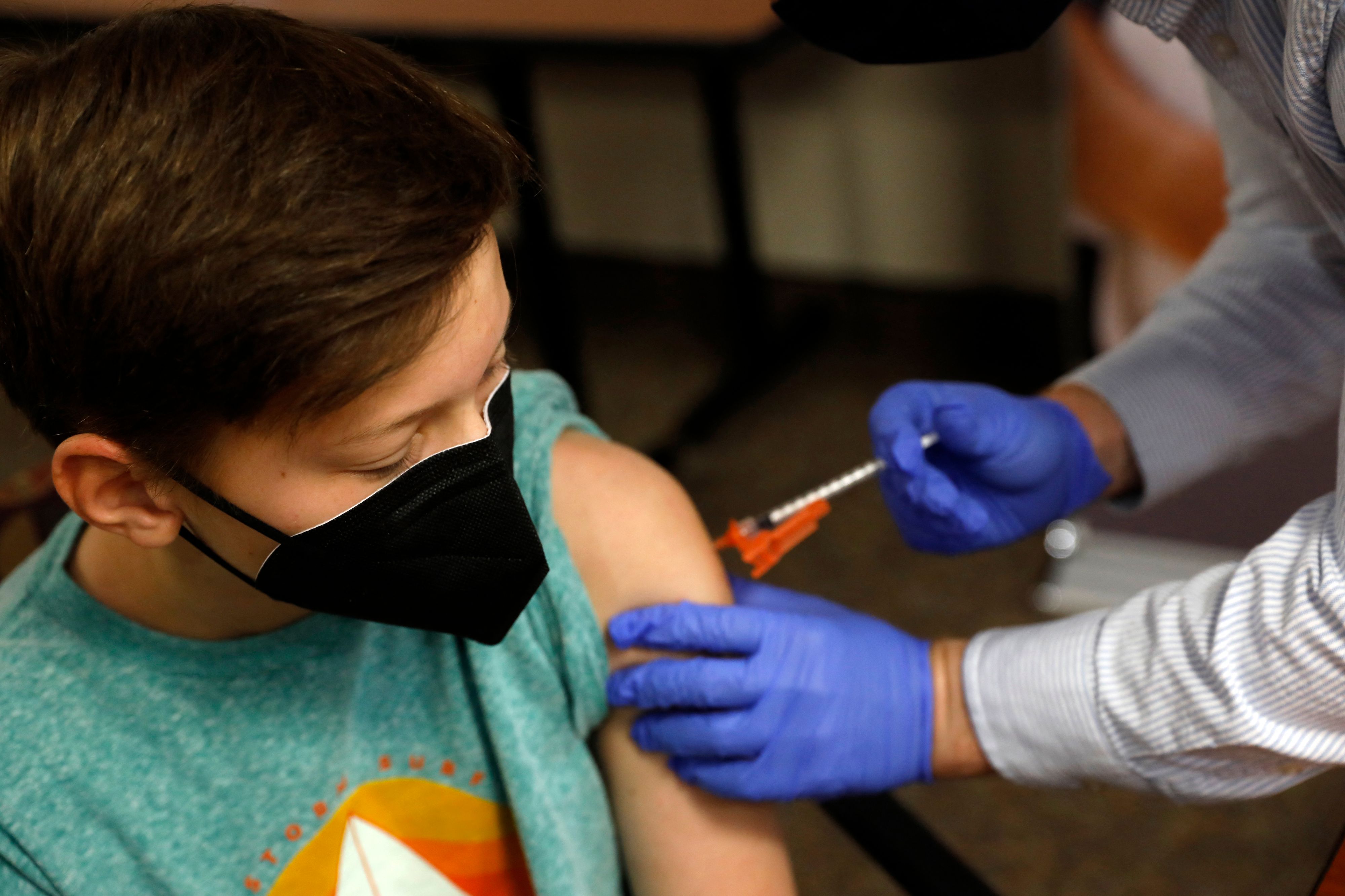 A pharmacist administers a shot of the Pfizer-BioNTech COVID-19 vaccine in Michigan, in May 2021.