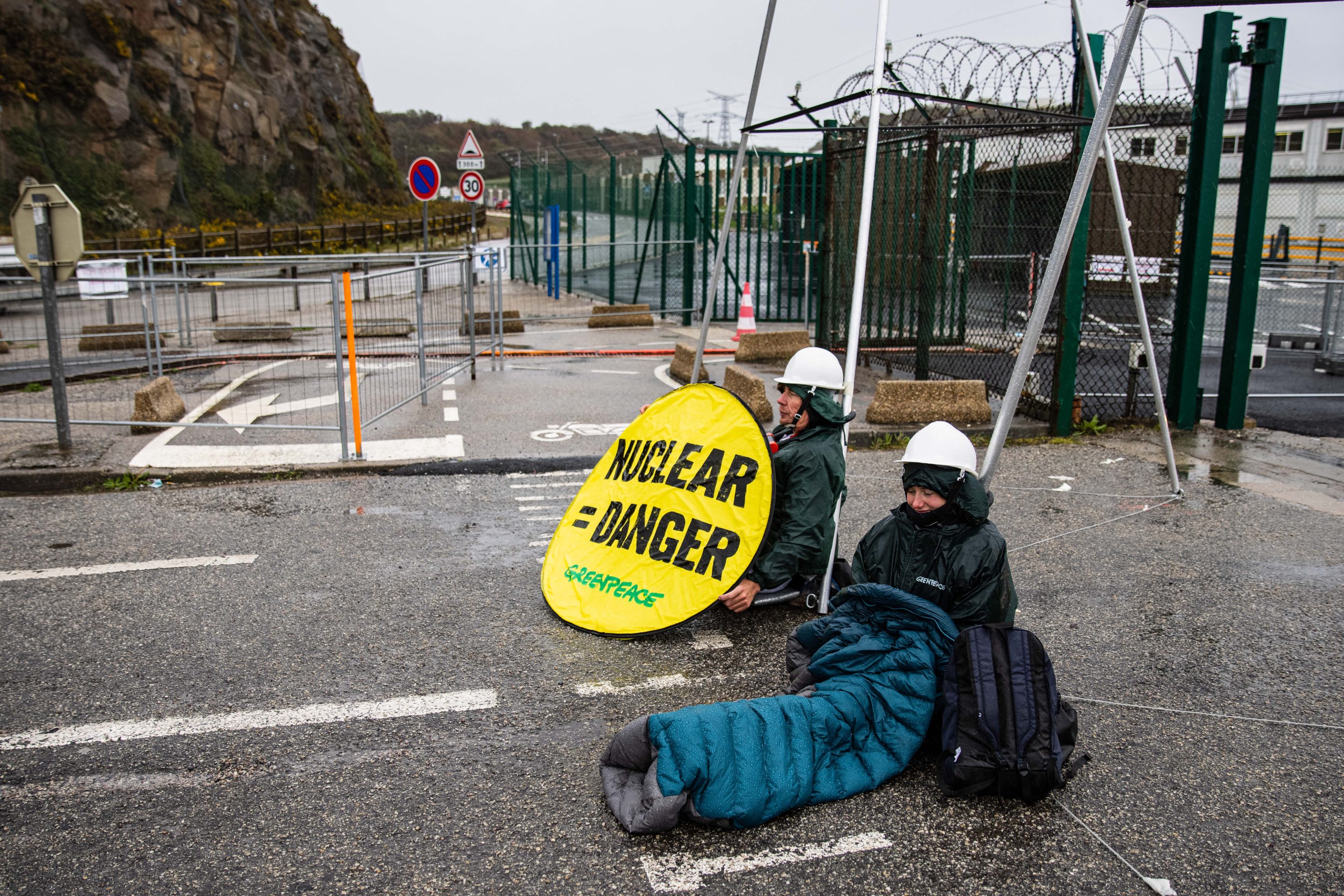 Greenpeace activists block the entrance to the Flamanville nuclear power plant in Normandy, France, to protest against pro-nuclear presidential candidates on March 31, 2022, ahead of the French presidential election of April 10.
