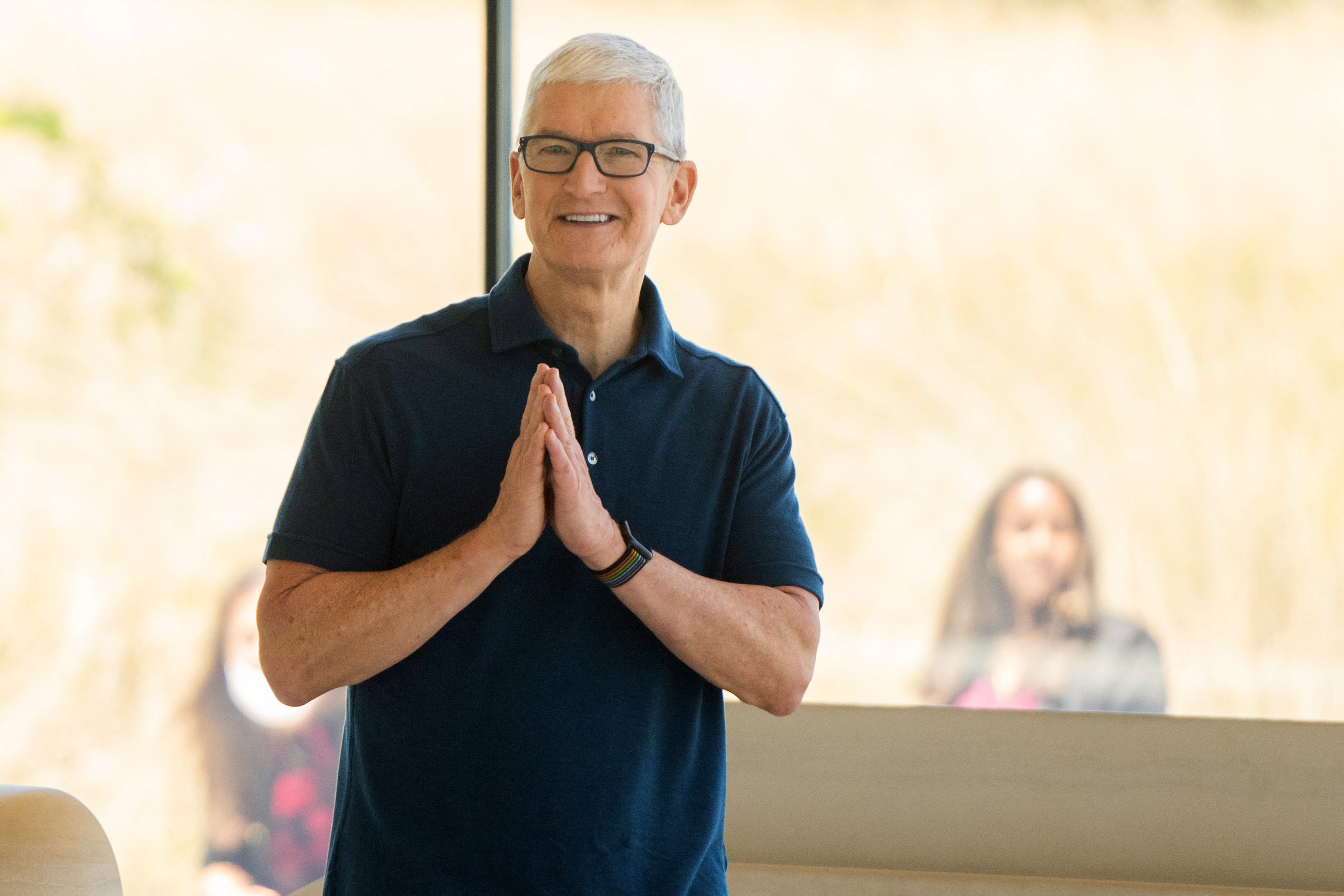 Apple CEO Tim Cook gestures as he enters the Steve Jobs Theater during the 2022 Apple Worldwide Developers Conference (WWDC), on June 6, 2022 at the Apple Park campus in Cupertino, Calif.