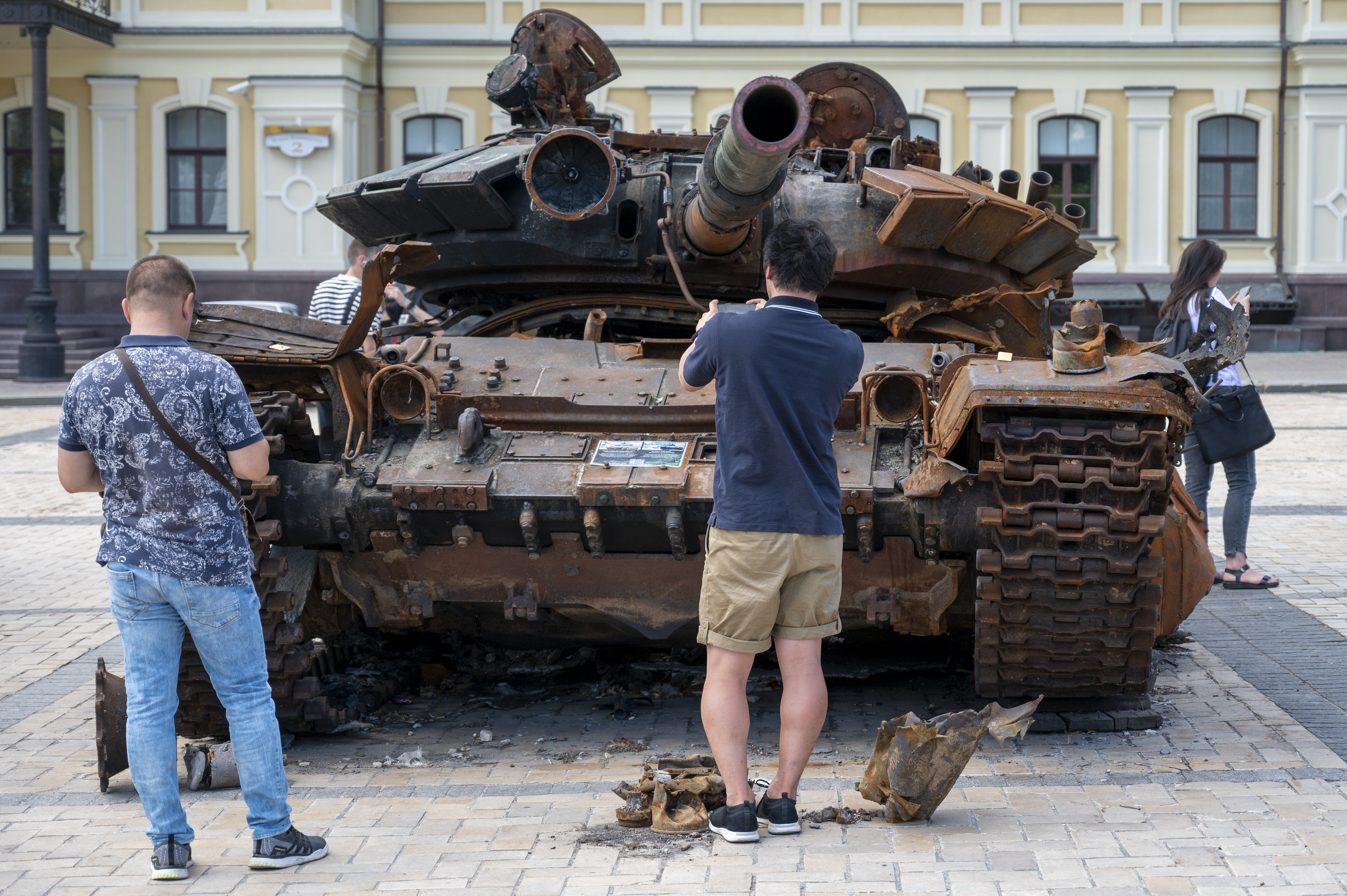 25 July 2022, Ukraine, Kiew: On Michael Square in the city center there are destroyed Russian military vehicles