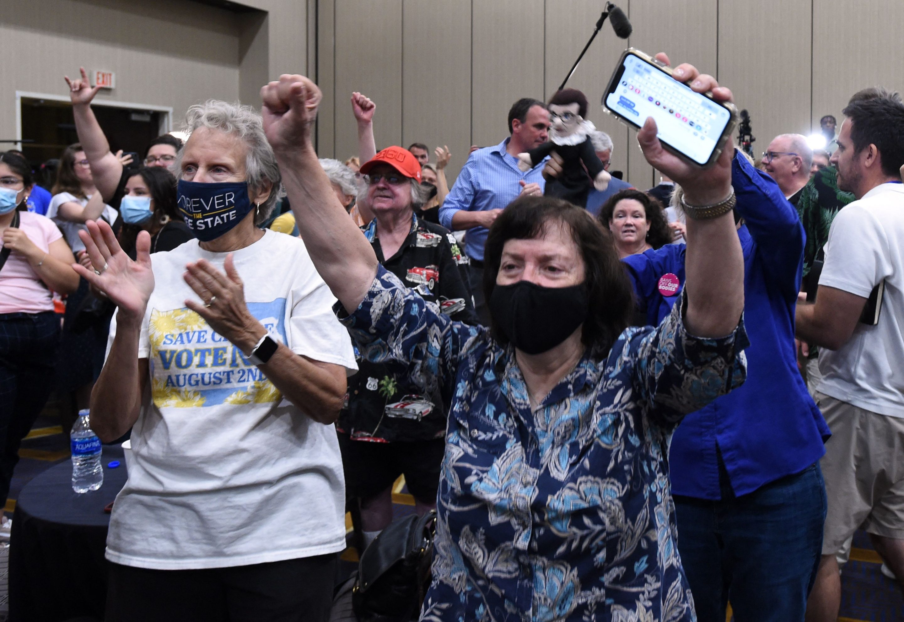 Pro-choice supporters in Kansas cheer as the proposed state constitutional amendment fails.