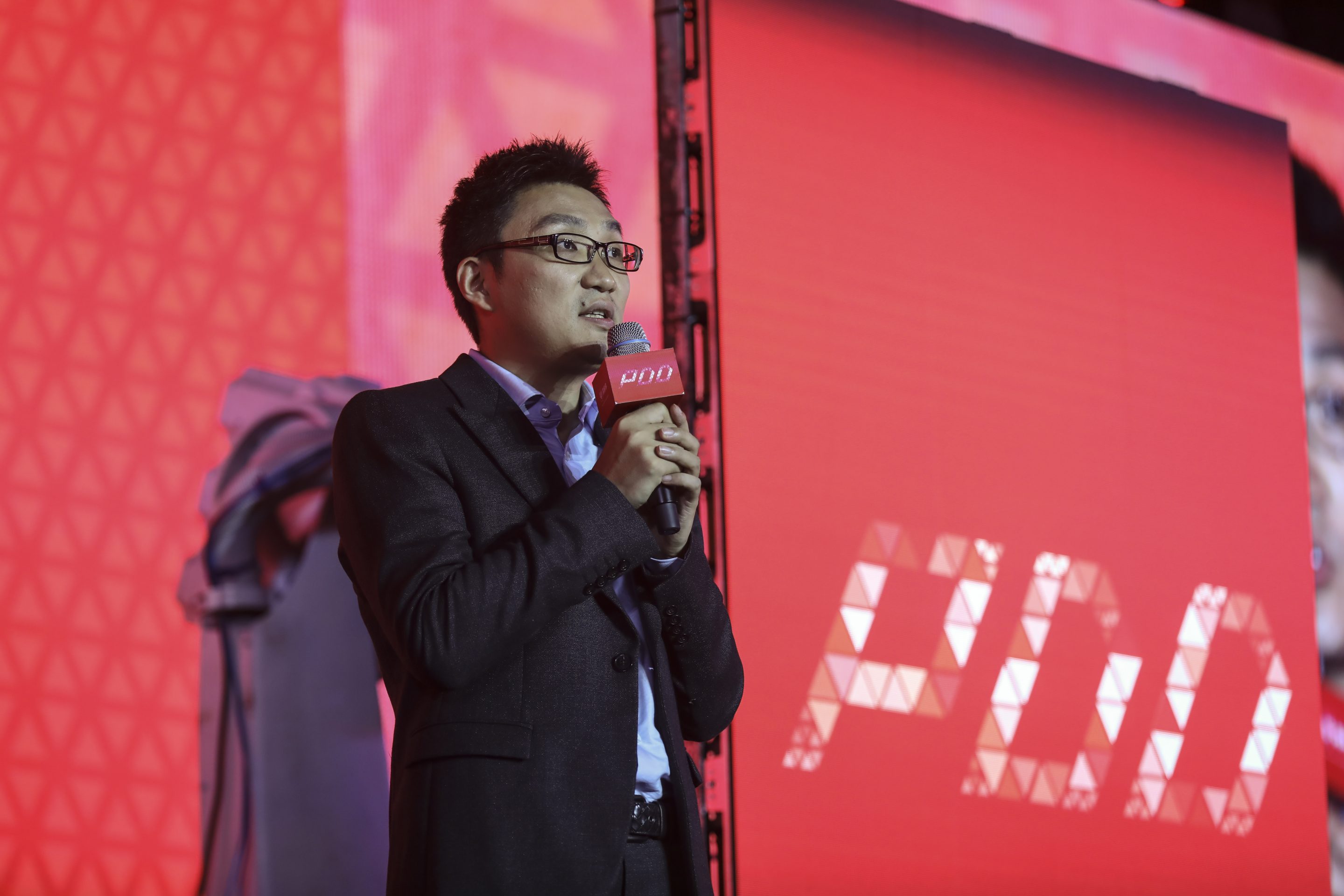 Colin Huang, founder and former CEO of Pinduoduo, speaks at the company’s listing ceremony at Shanghai Tower on July 26, 2018.