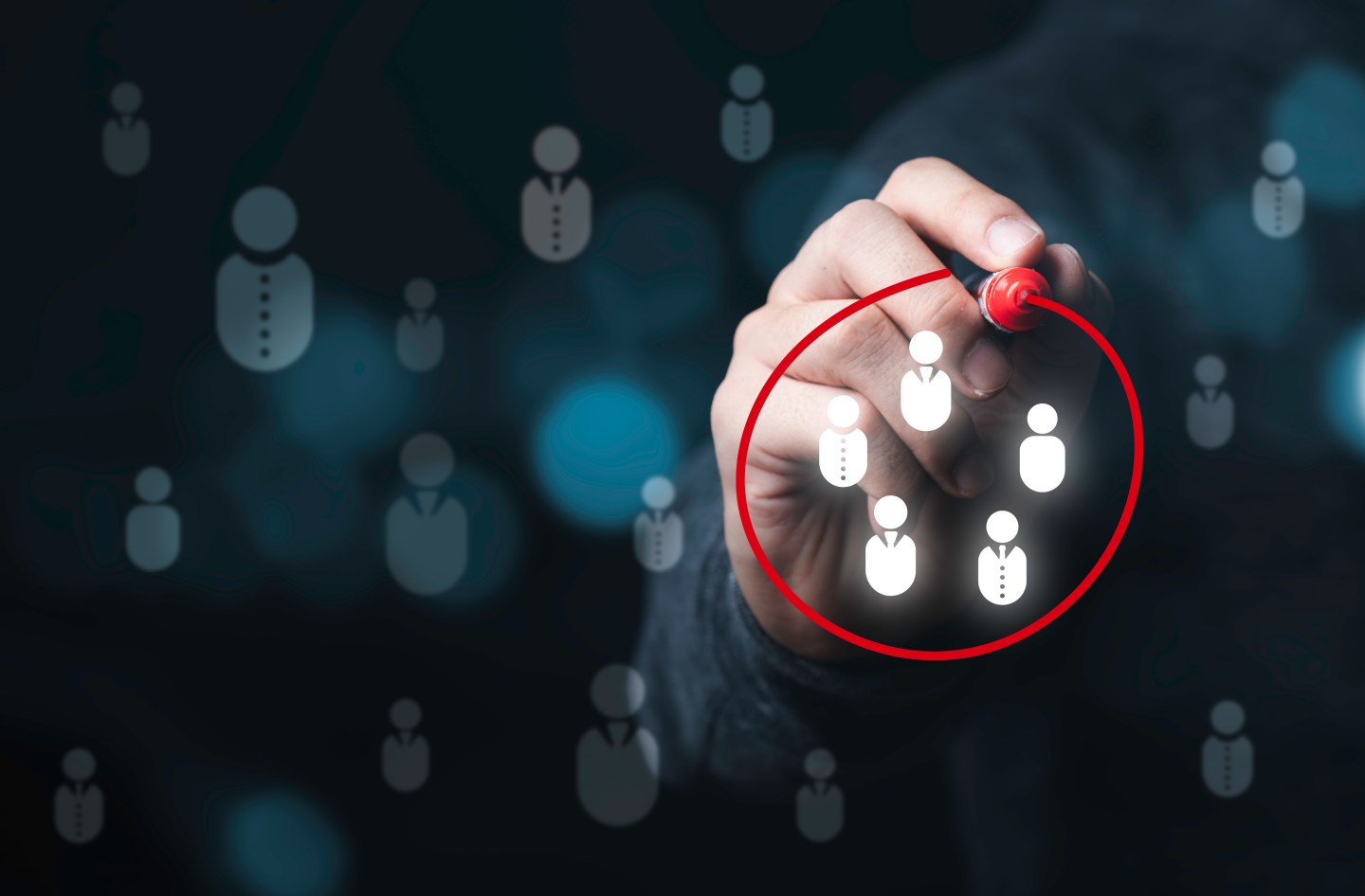 Businessman drawing red circle to marking and select human icons