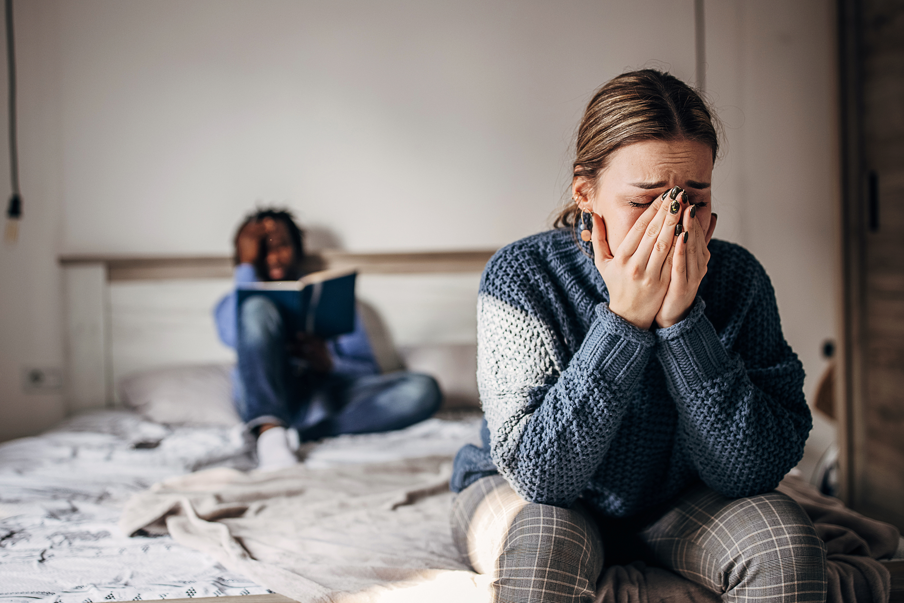 Young adults crying