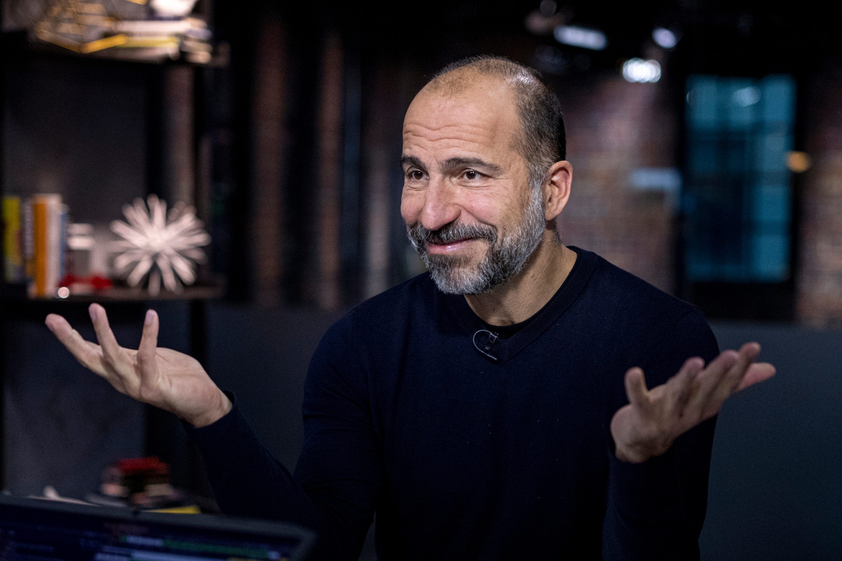 Uber CEO with hands shurgged.