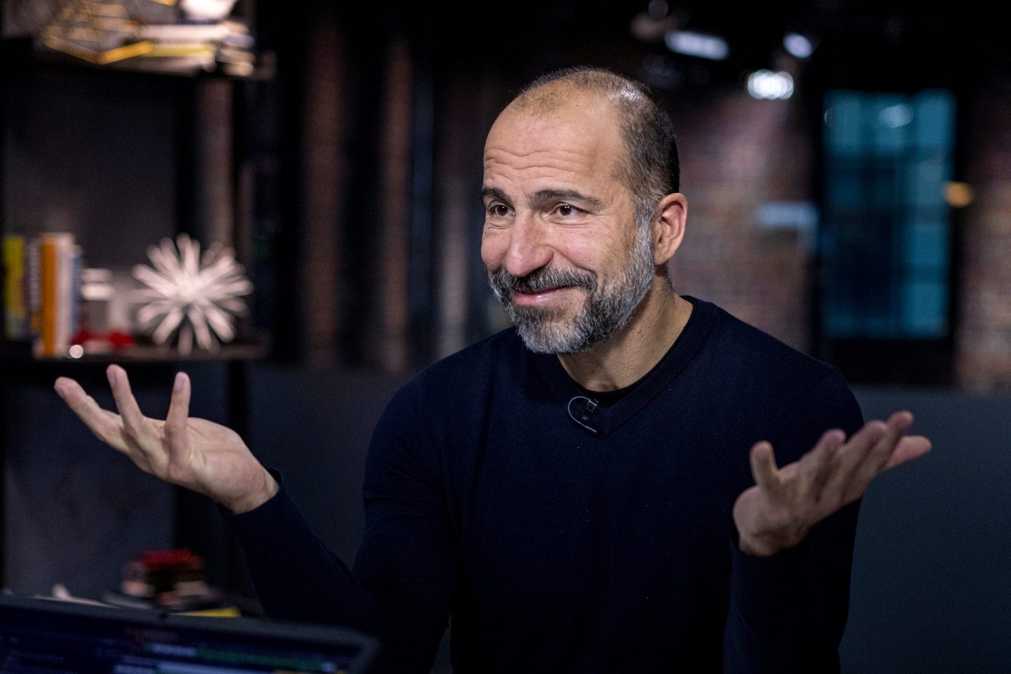 Uber CEO with hands shurgged.