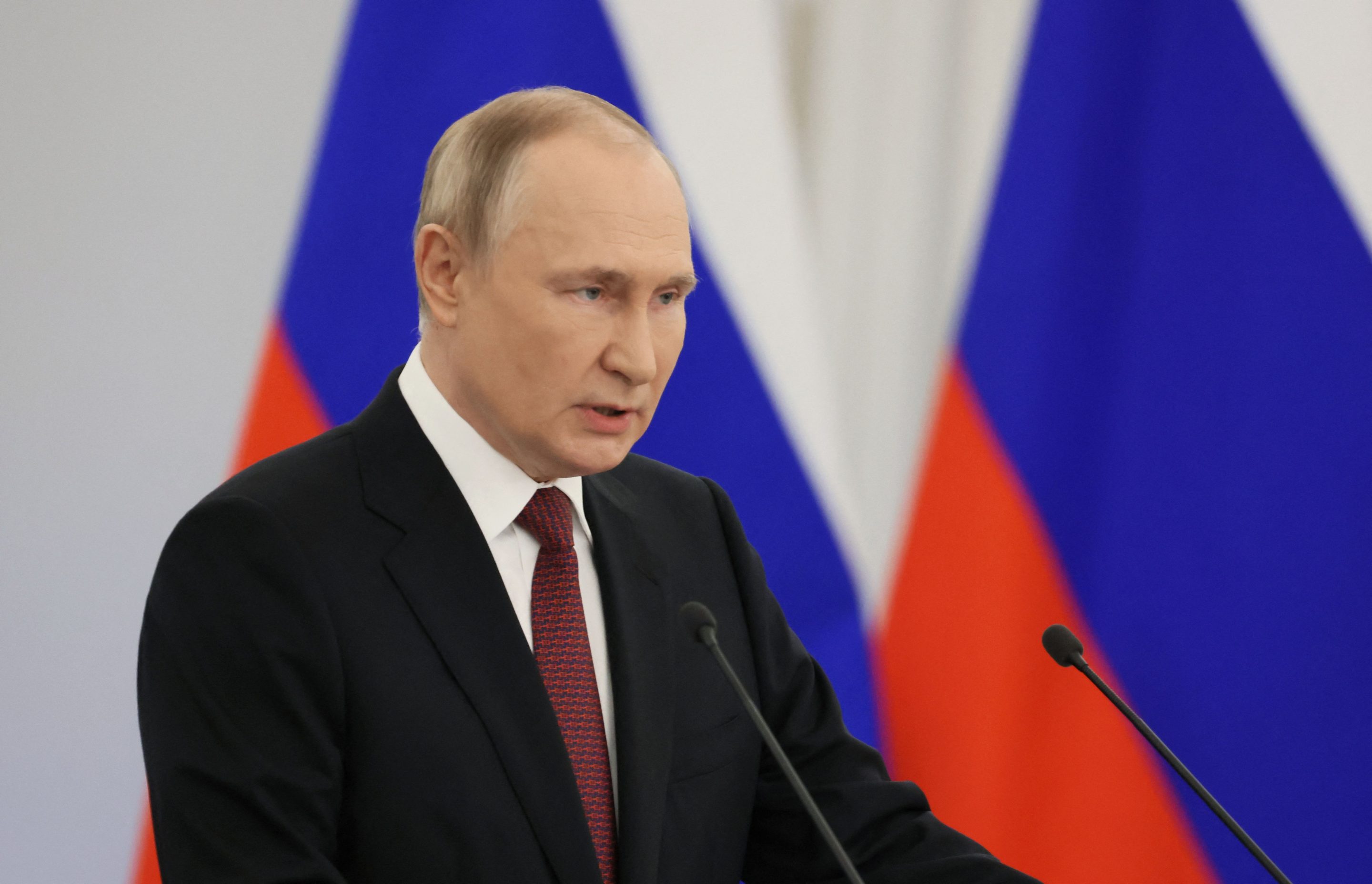 Vladimir Putin talks Friday at a ceremony in Moscow formally annexing four Russia-occupied regions of Ukraine.
