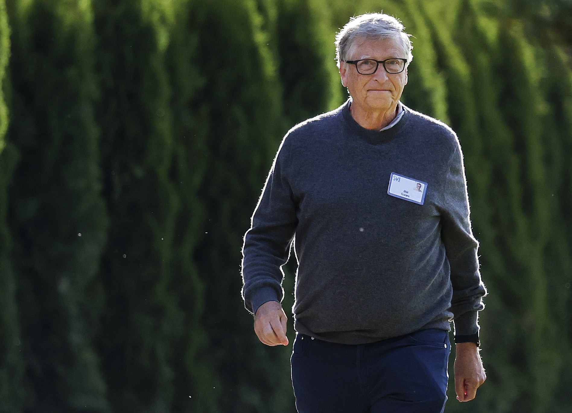 Bill Gates seen walking outdoors at a conference in Idaho.