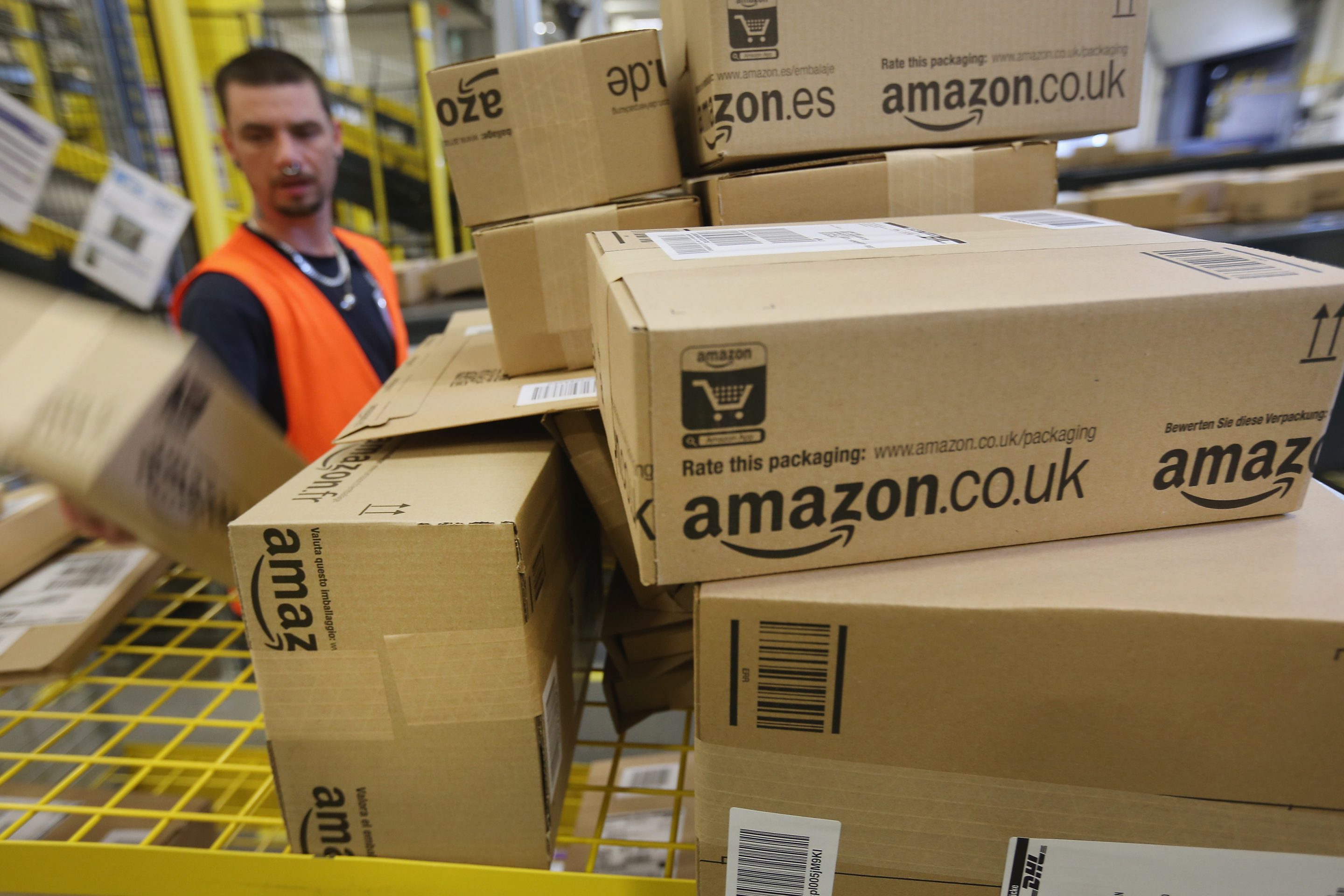 An Amazon worker handles boxes