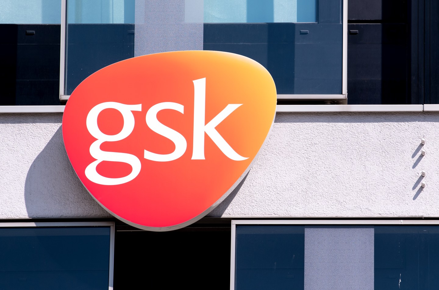 The logo of GSK at the company's offices.