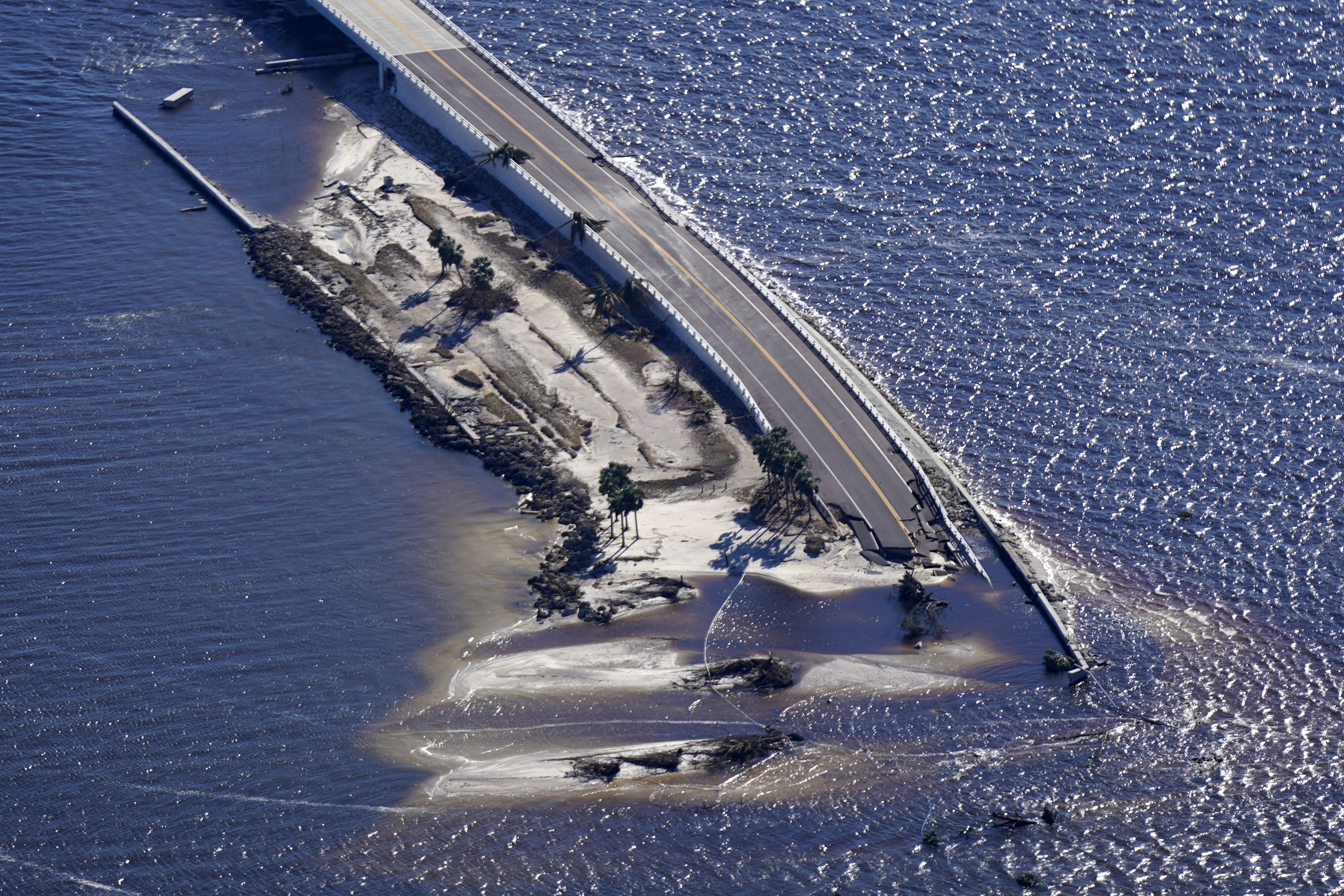 Damage from Hurricane Ian is seen on the causeway leading to Sanibel Island from Fort Myers, Fla., Sept. 30, 2022.