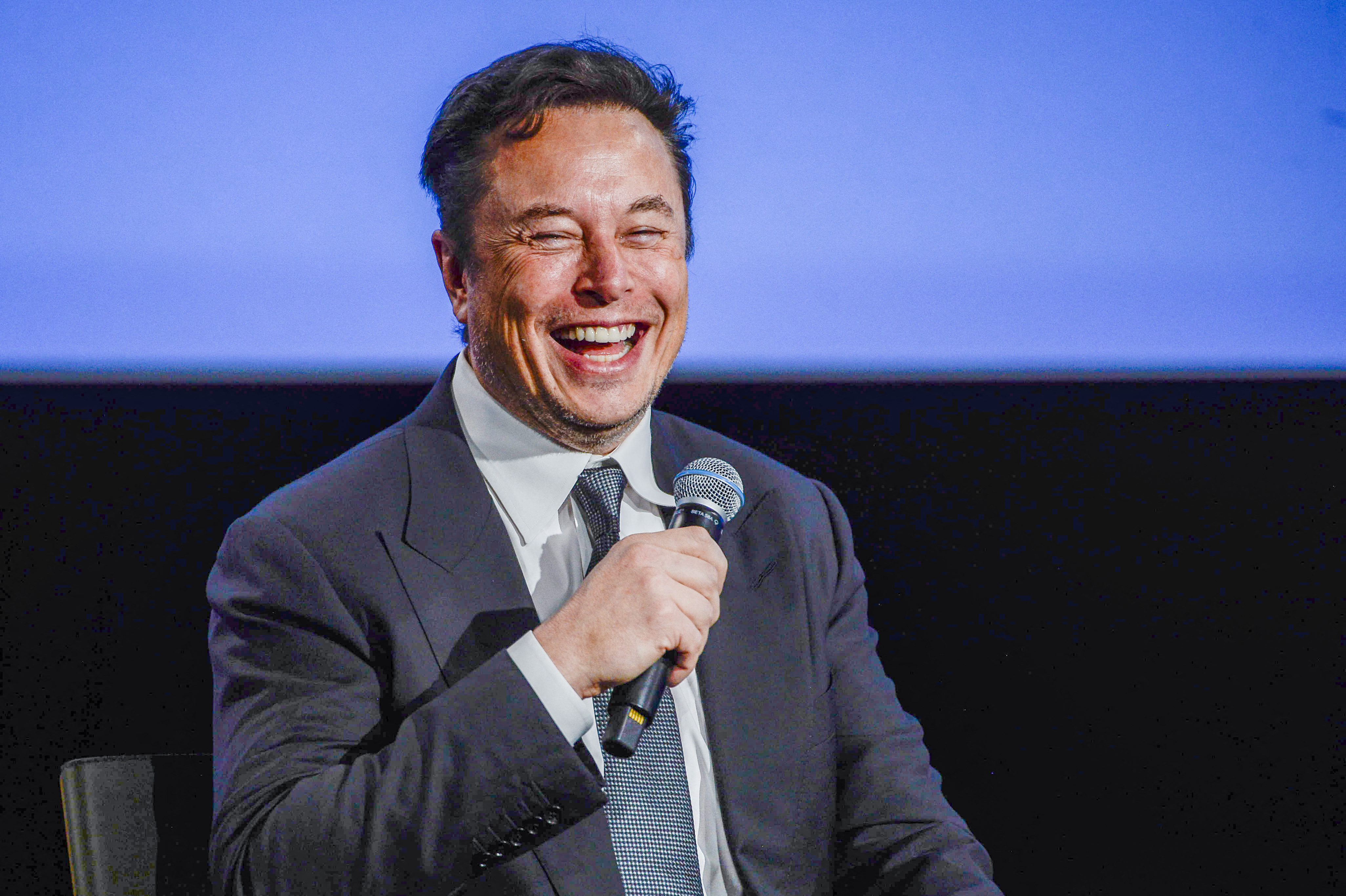 Elon Musk smiles as he addresses guests at the Offshore Northern Seas 2022 meeting in Stavanger, Norway on August 29, 2022.