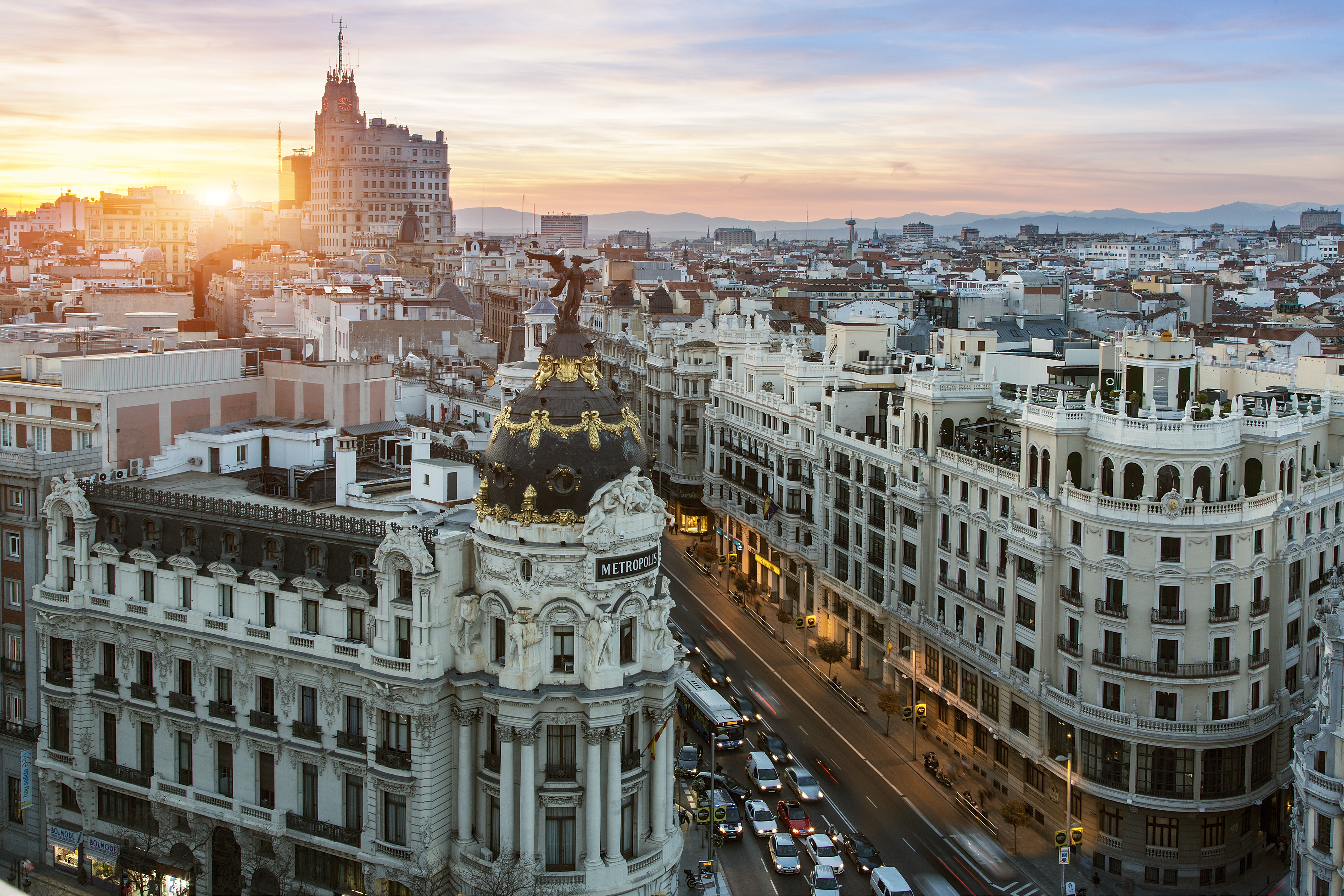 The sun rises over buildings in Europe.