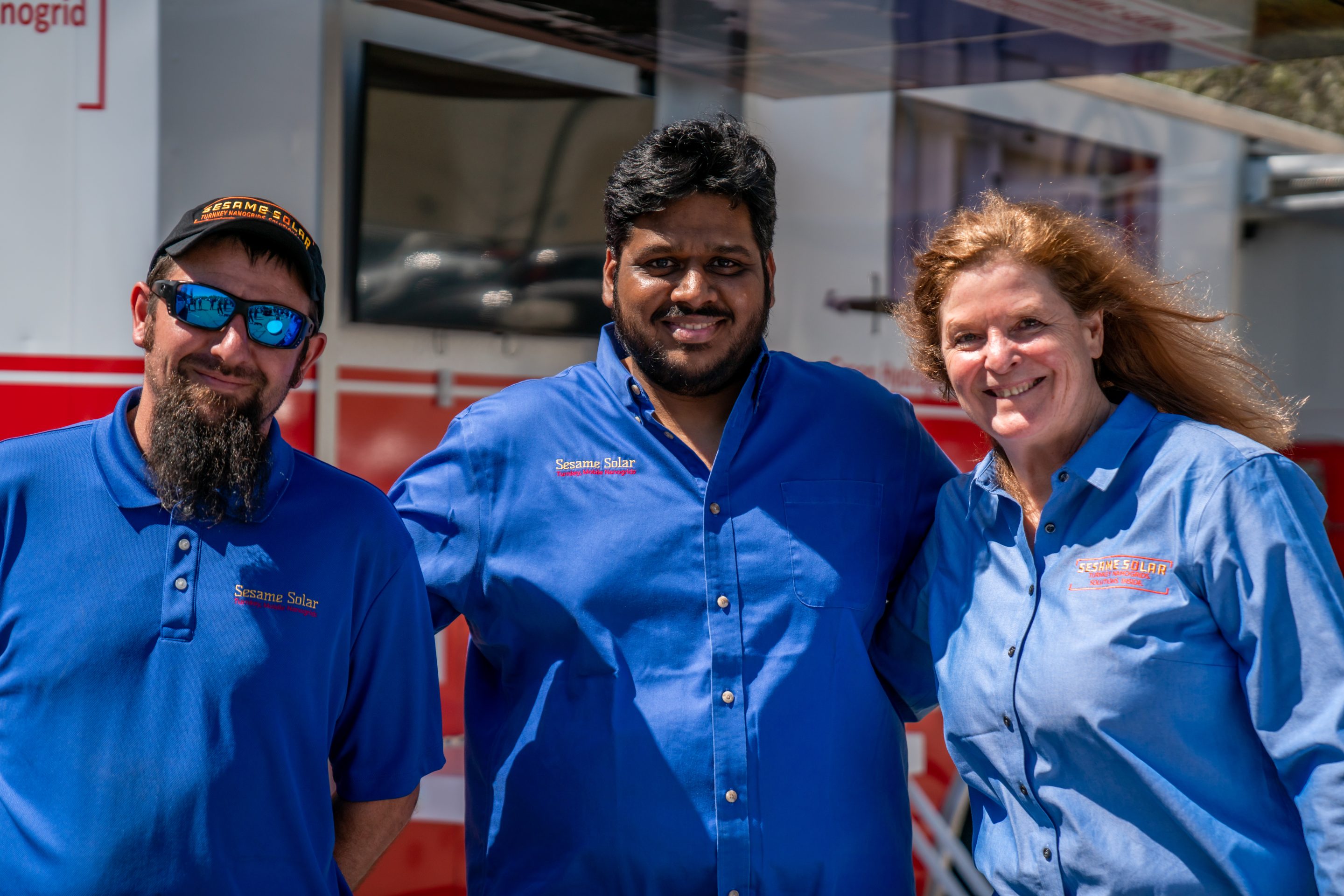 Sesame Solar's Lauren Flanagan (R) and her co-founders Namit Jhanwar (C) and Adam Kasefang (L).