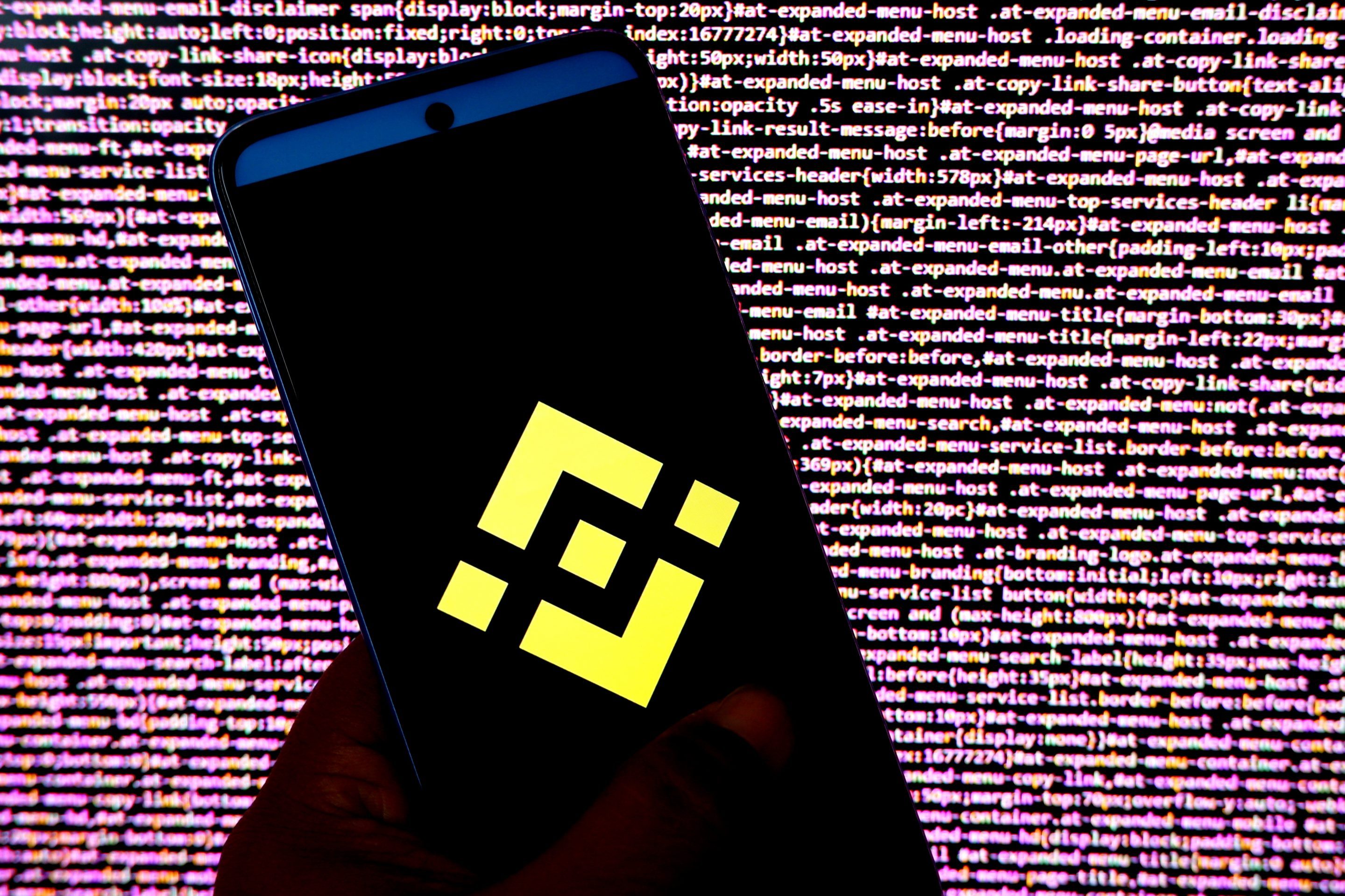 A photo illustration of the Binance logo