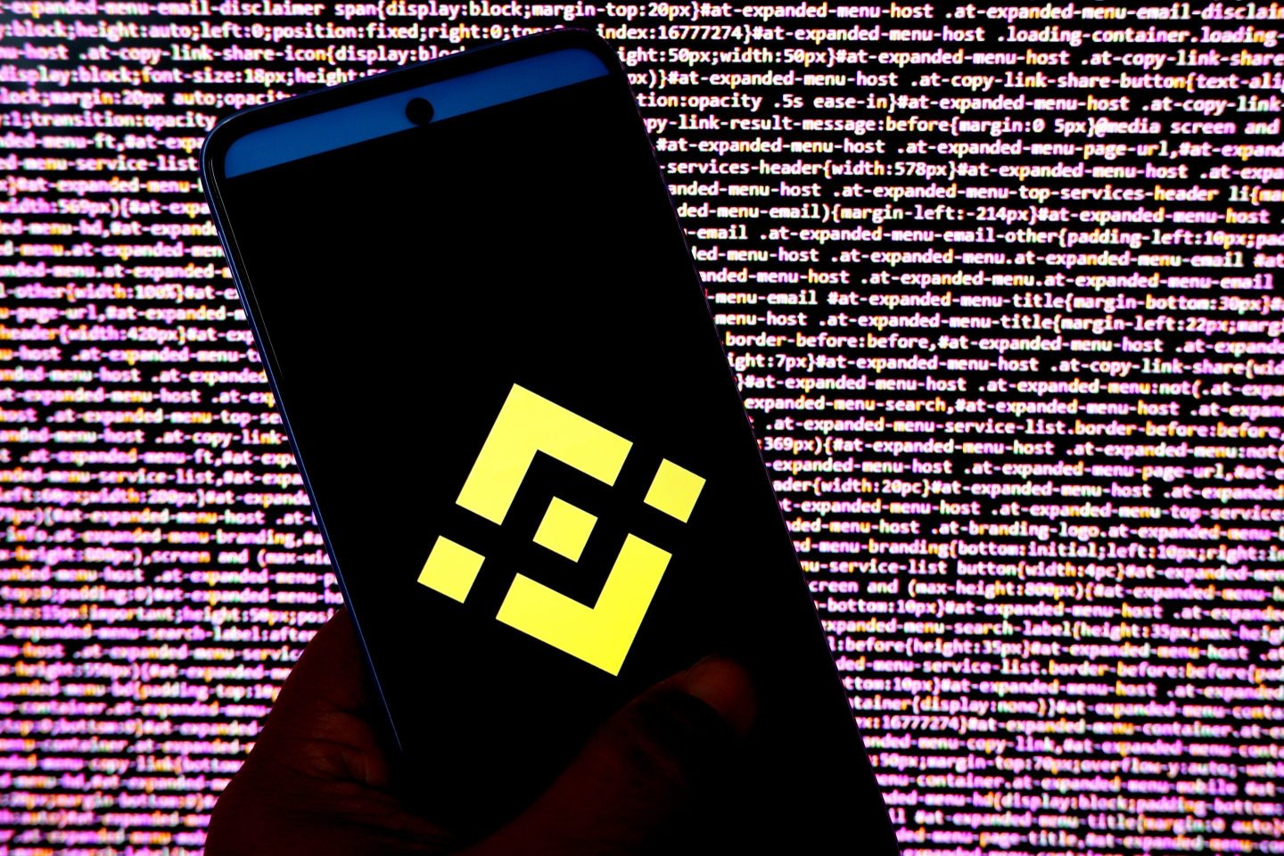 A photo illustration of the Binance logo