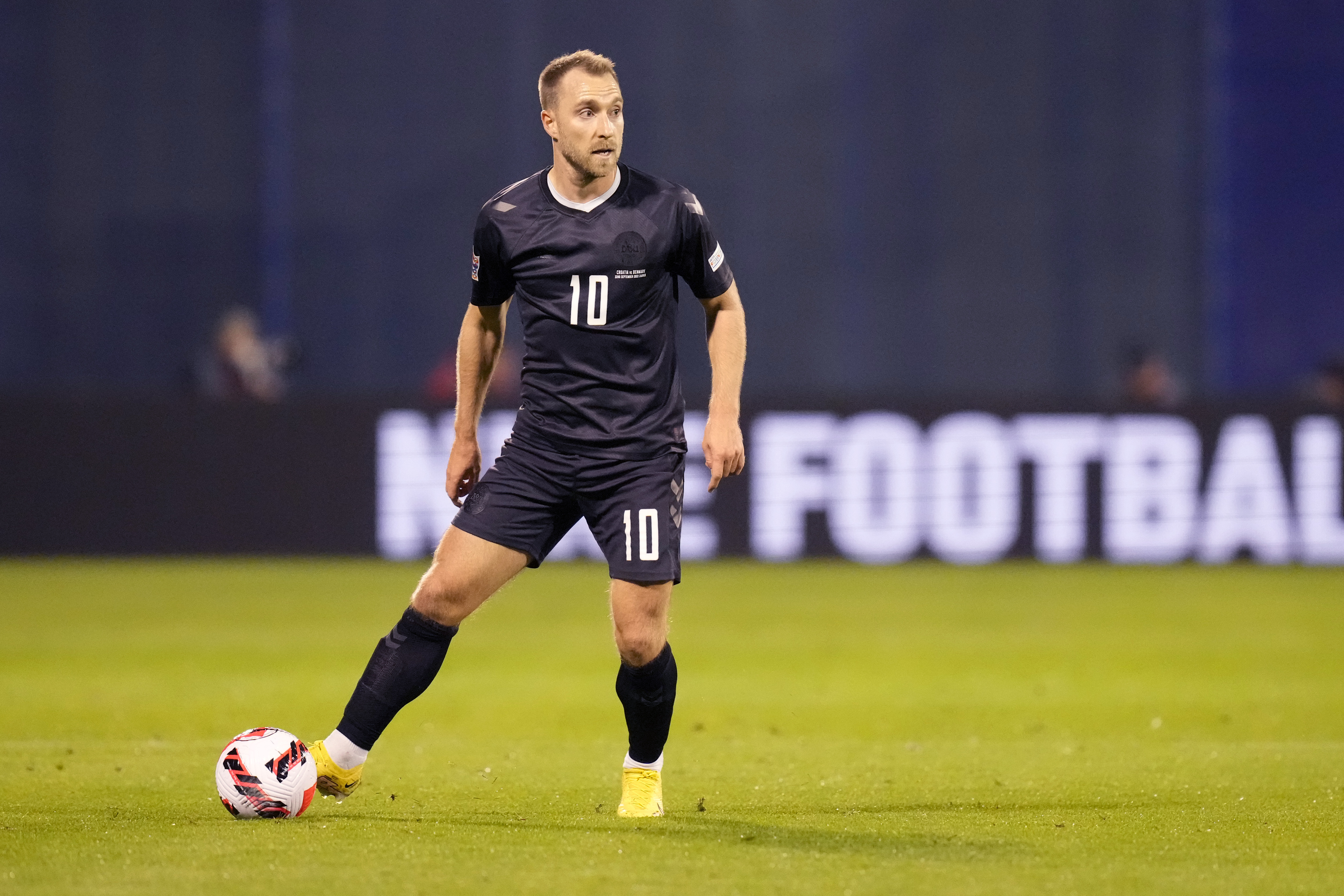 A soccer player wearing a black jersey.
