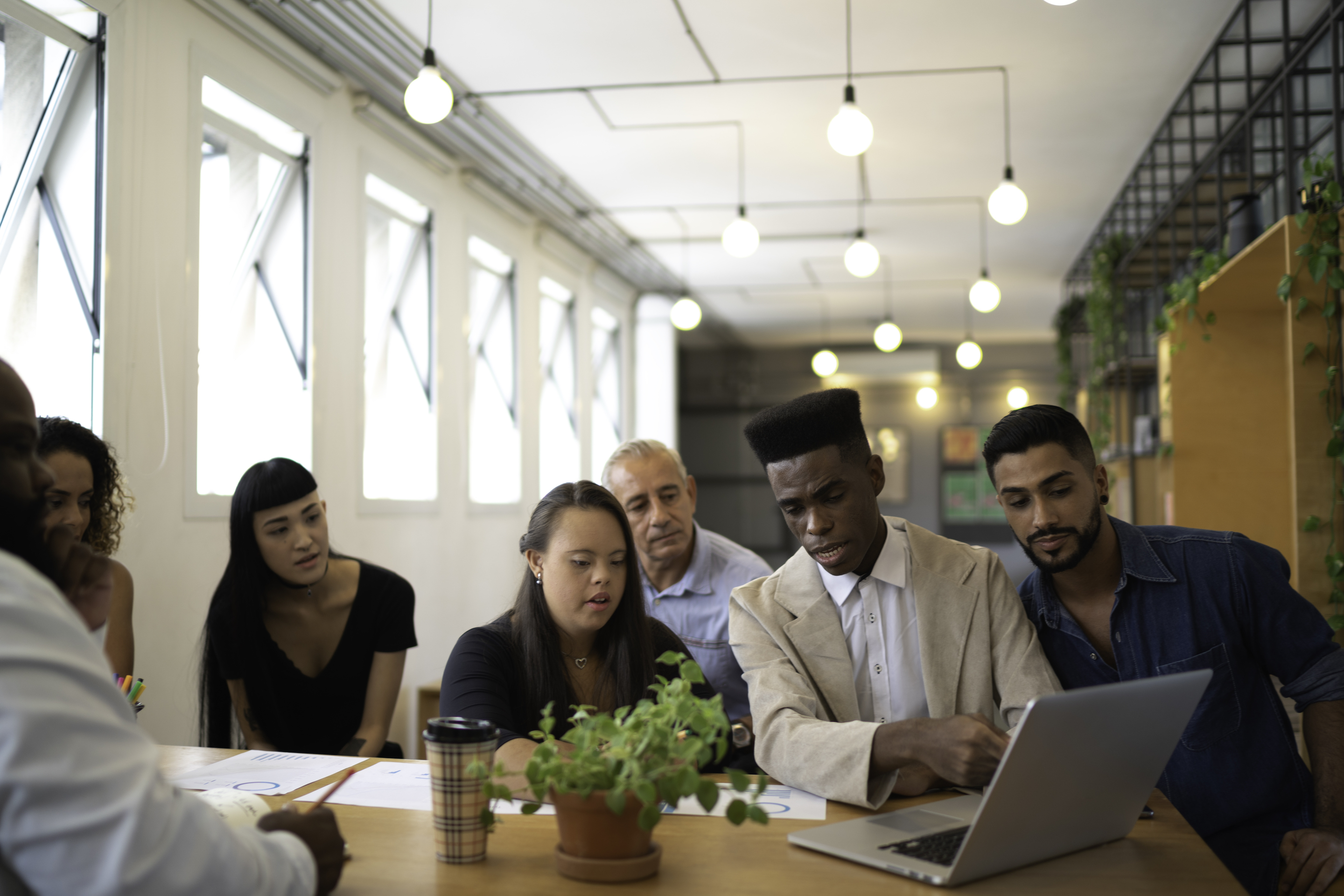 Young people at a table working together