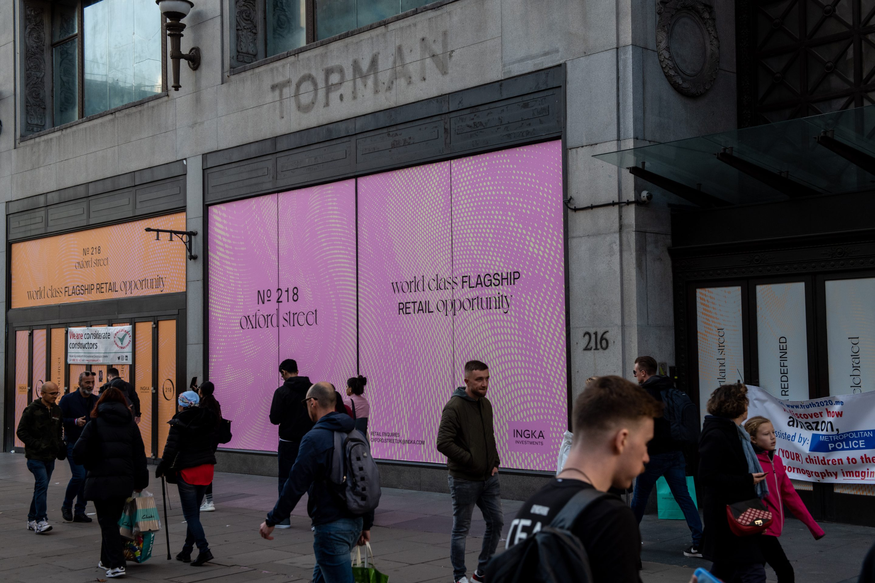 Shoppers pass an empty retail unit on Oxford Street in London on Nov. 4.