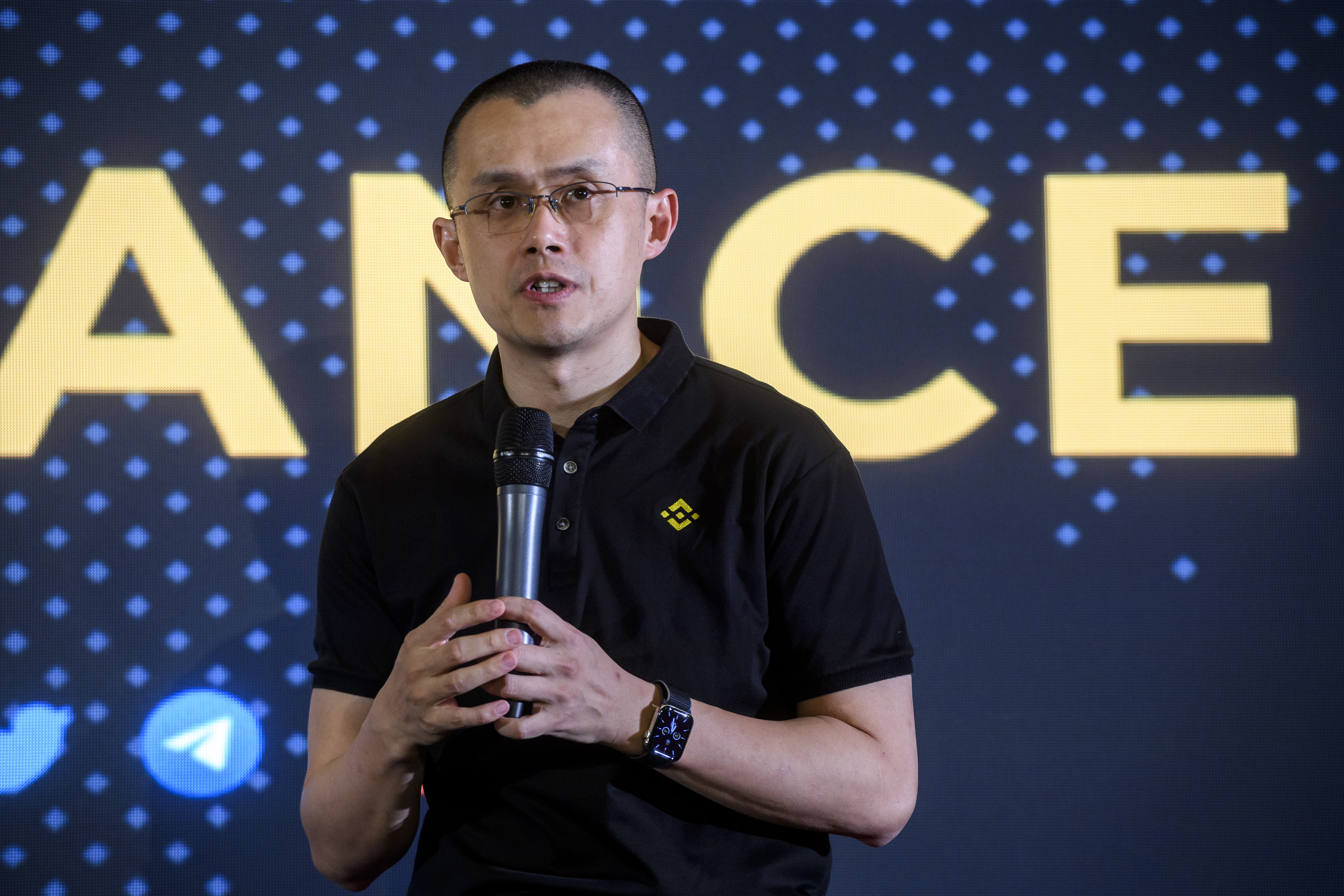 Shot of Binance CEO Changpeng Zhao speaking onstage at a Binance event in Italy