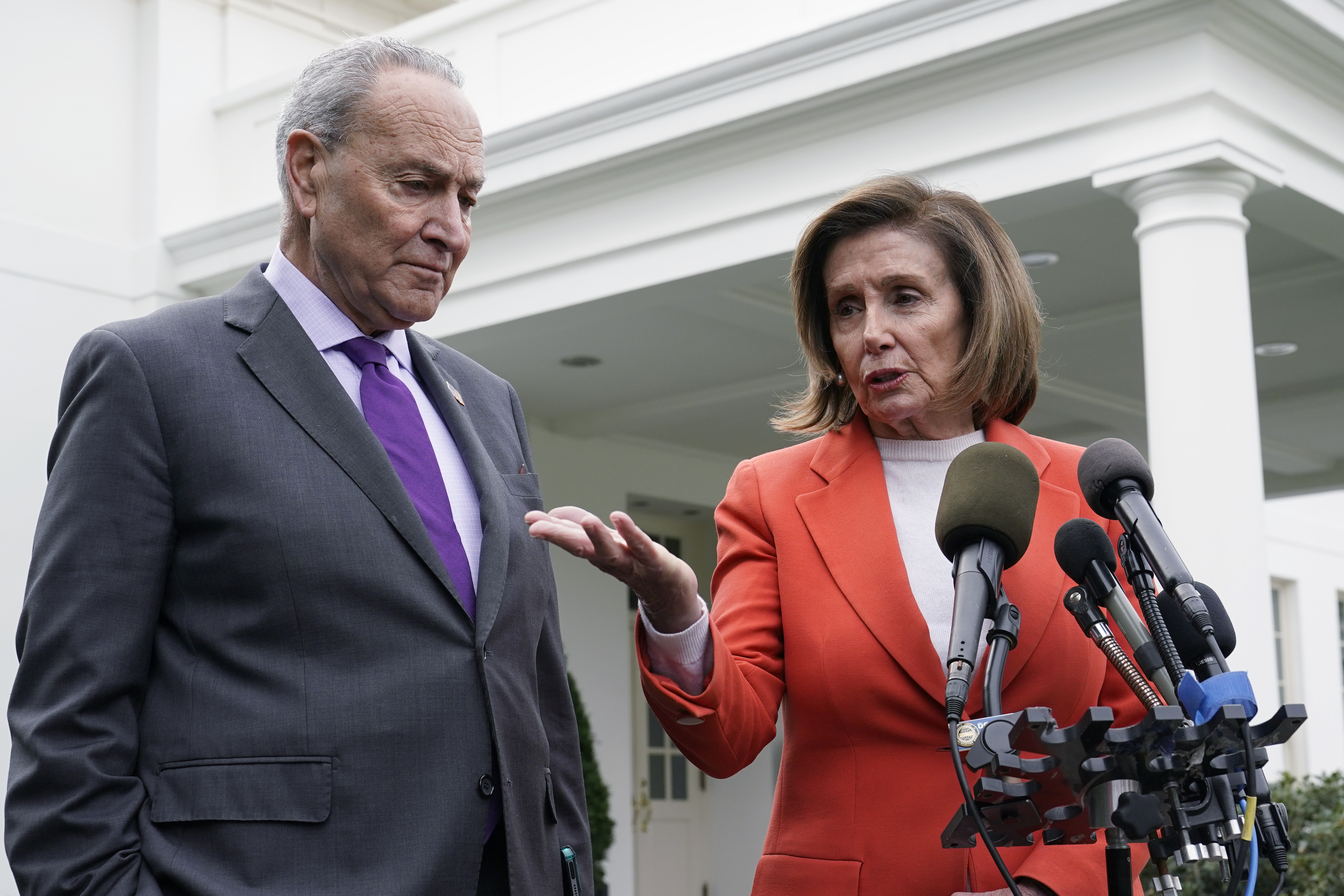 Senate Majority Leader Chuck Schumer of N.Y., right, listens as House Speaker Nancy Pelosi of Calif., left, speaks to reporters at the White House in Washington, Nov. 29, 2022, about their meeting with President Joe Biden. Congress is moving swiftly to prevent a looming U.S. rail workers strike.