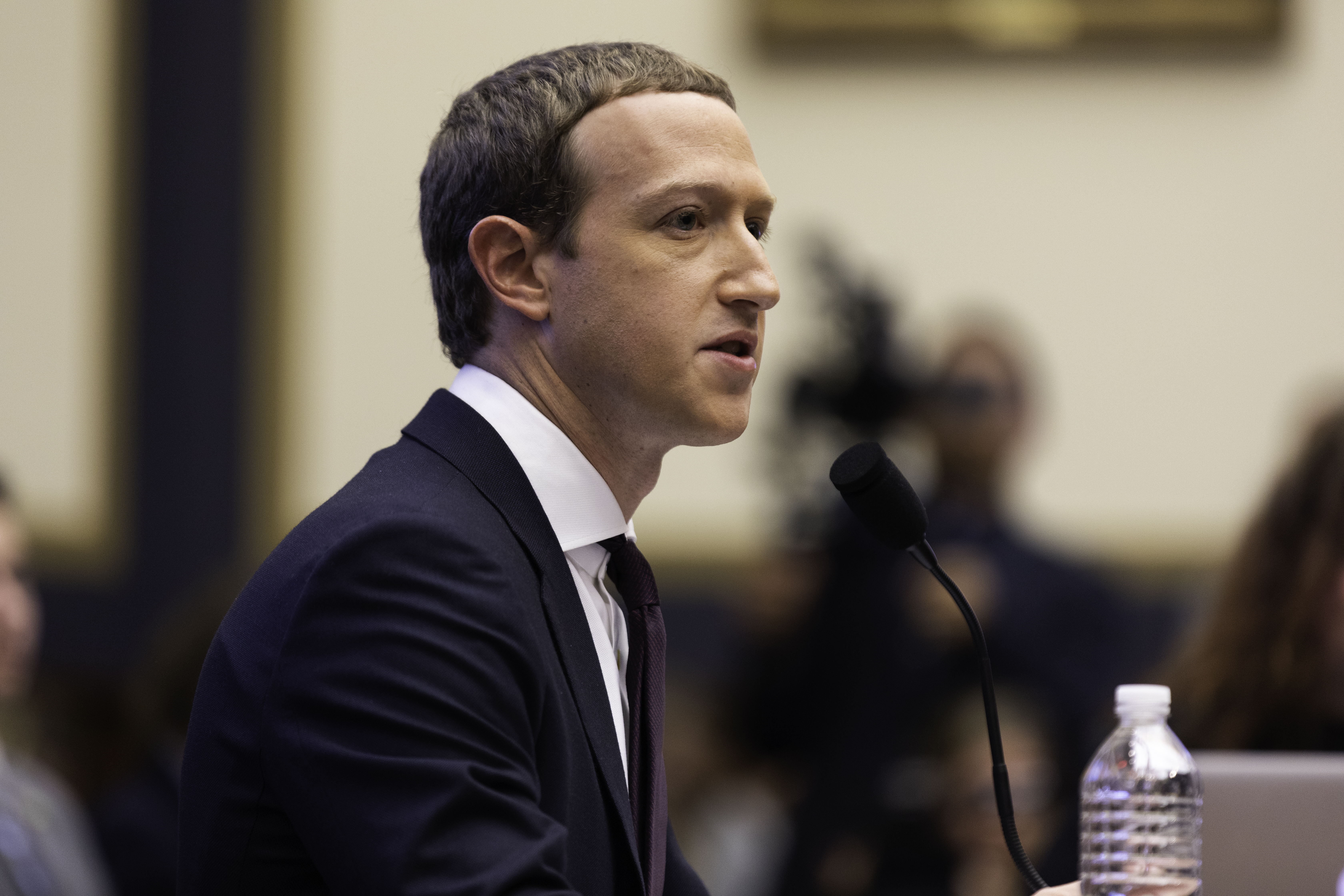 Side shot of Meta CEO Mark Zuckerberg testifying before Congress in 2019
