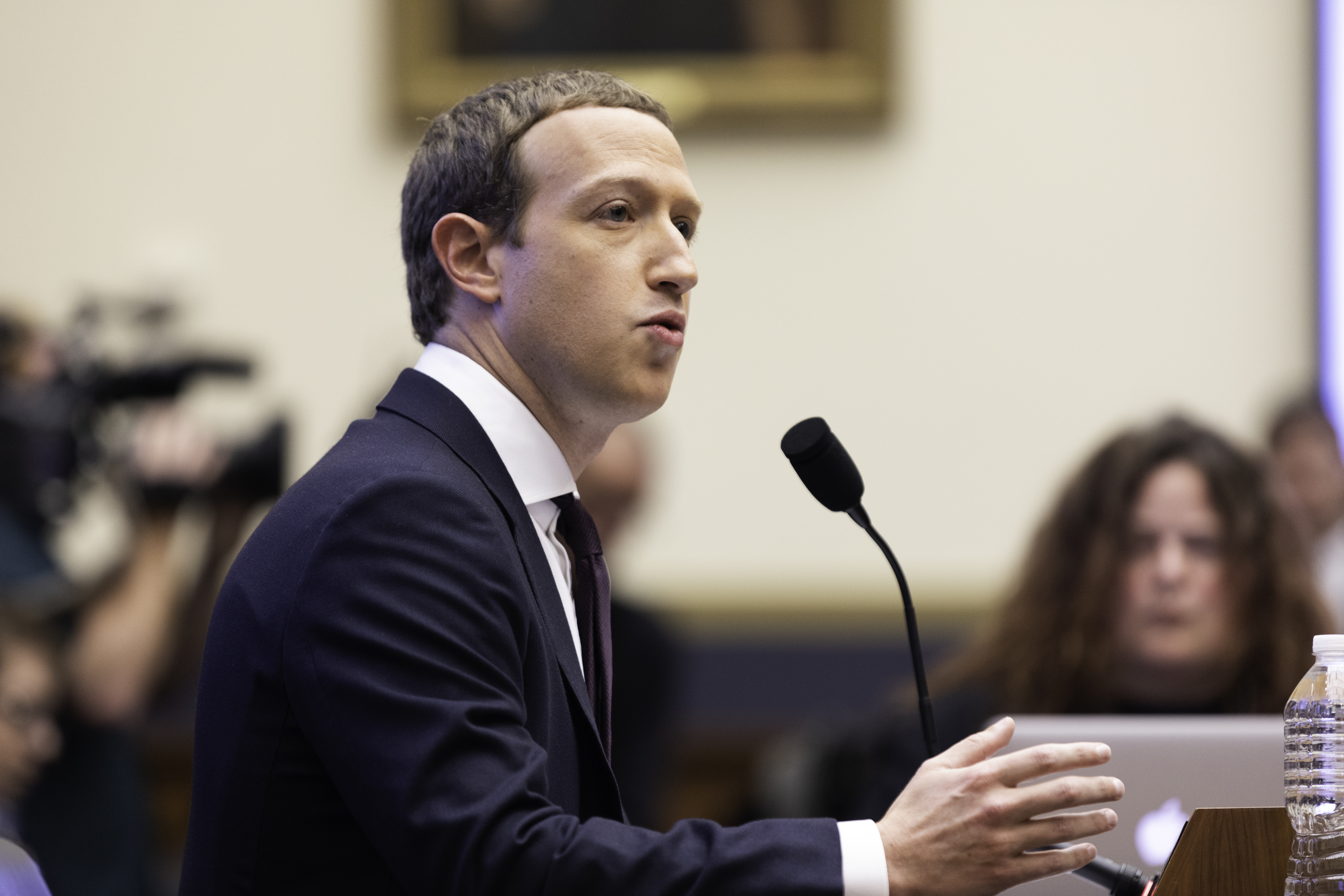 Meta CEO Mark Zuckerberg speaking in front of a microphone.