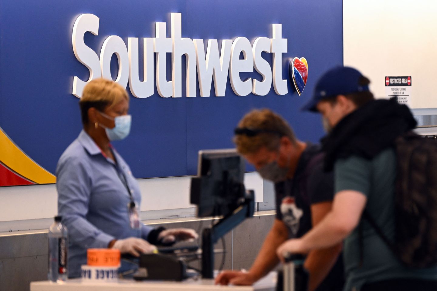 Passengers checking in at a Southwest Airlines flight at Los Angeles International Airport