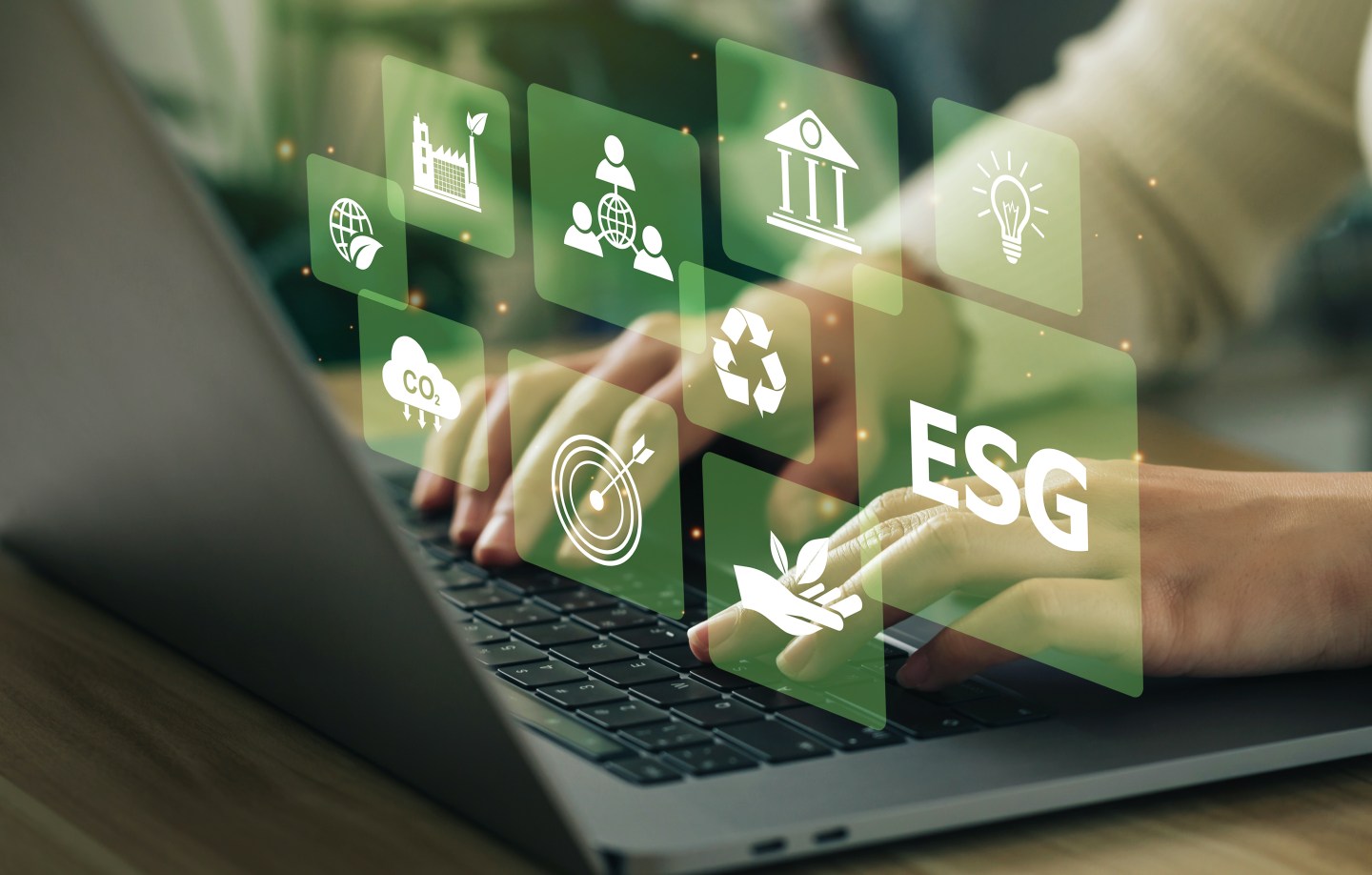 ESG environment social governance investment business concept. Women use a computer to analyze ESG, surrounded by ESG icons .close to the computer screen in business investment strategy concept.