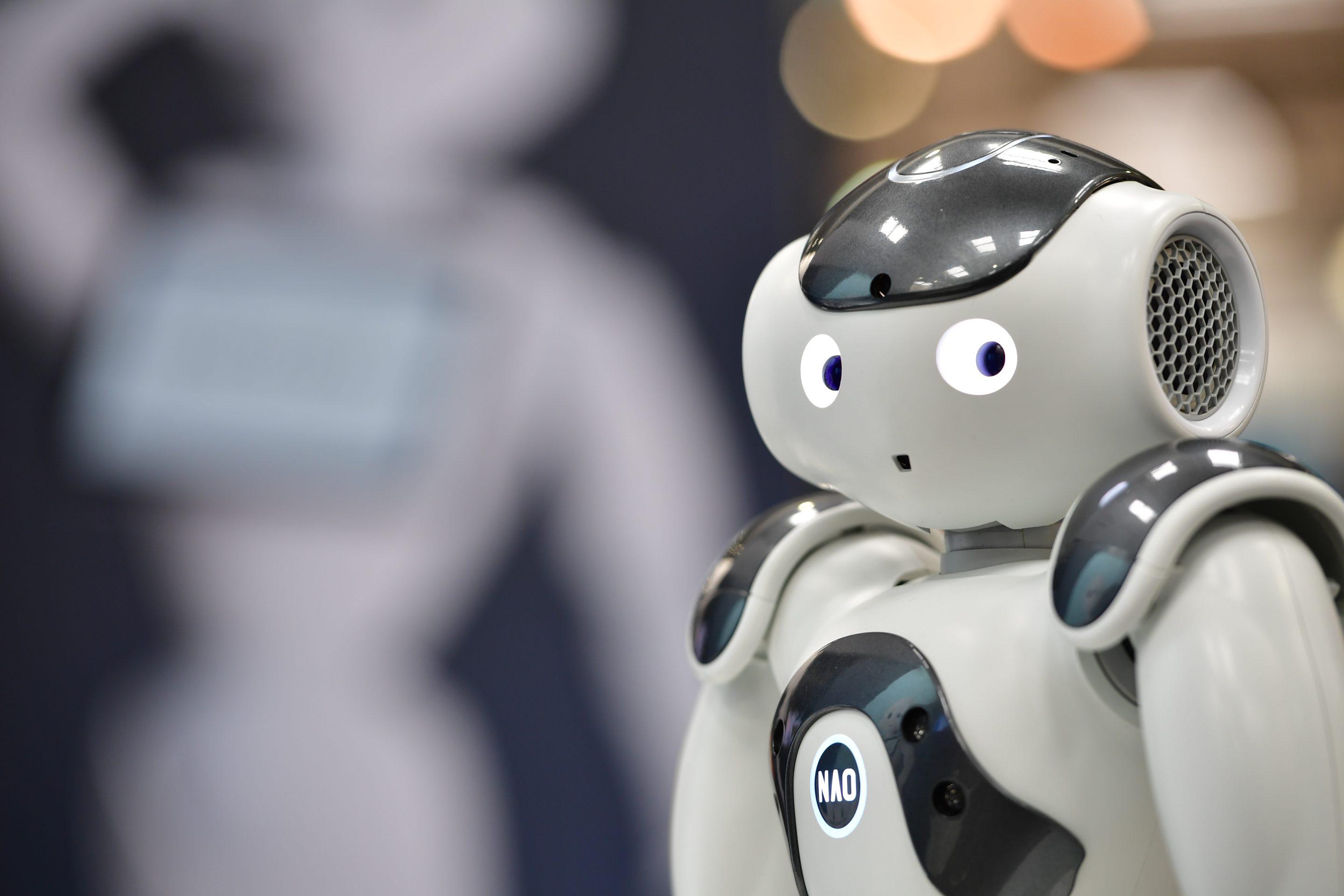 NAO, a humanoid robot, entertains visitors at the SoftBank Robotics stand at the 2018 CeBIT technology trade fair on June 12, 2018 in Hanover, Germany.