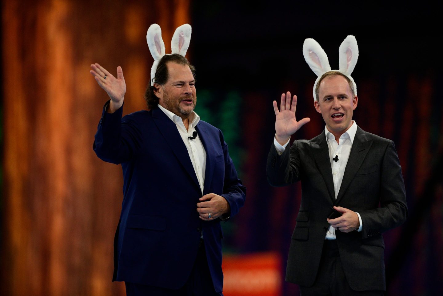 Bret Taylor, former co-chief executive officer of Salesforce.com Inc., right, and Marc Benioff, co-chief executive officer of Salesforce.com Inc., wear rabbit ears during a keynote at the 2022 Dreamforce conference in San Francisco,