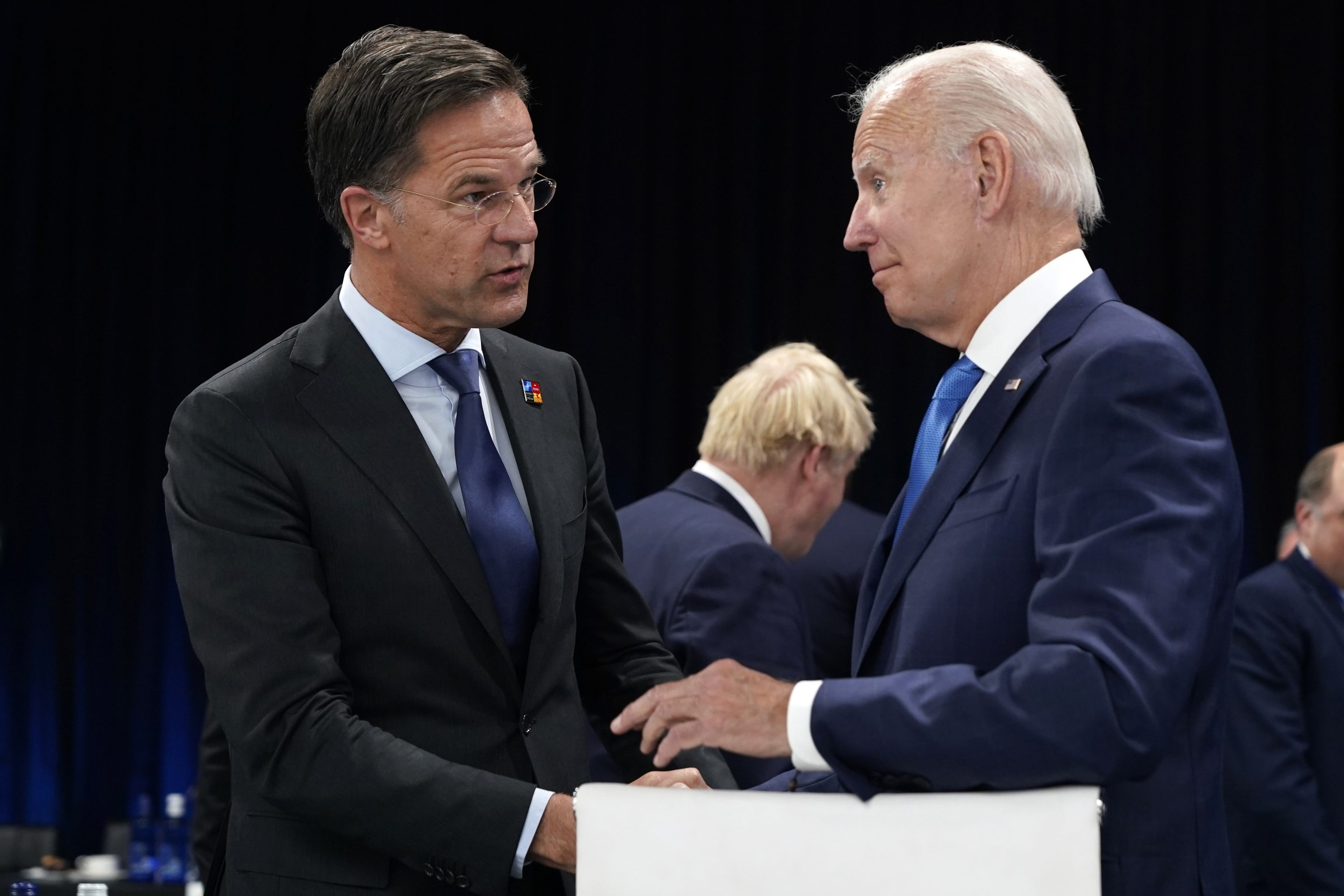 Netherland's Prime Minister Mark Rutte speaks with U.S. President Joe Biden during a round table meeting at a NATO summit in Madrid, Spain on June 29, 2022.