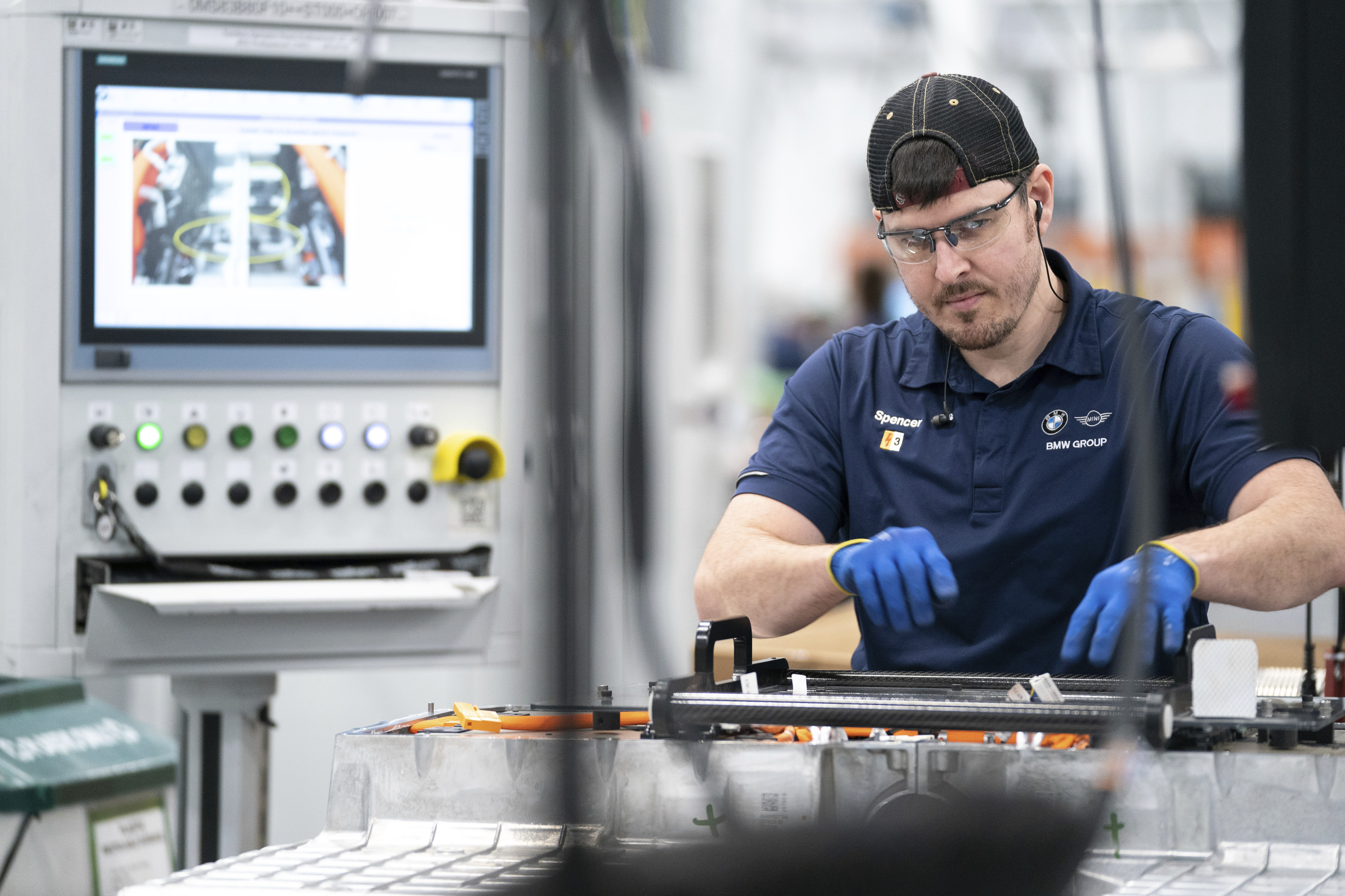 An employee works in the battery assembly hall at the BMW Spartanburg plant in Greer, S.C.,