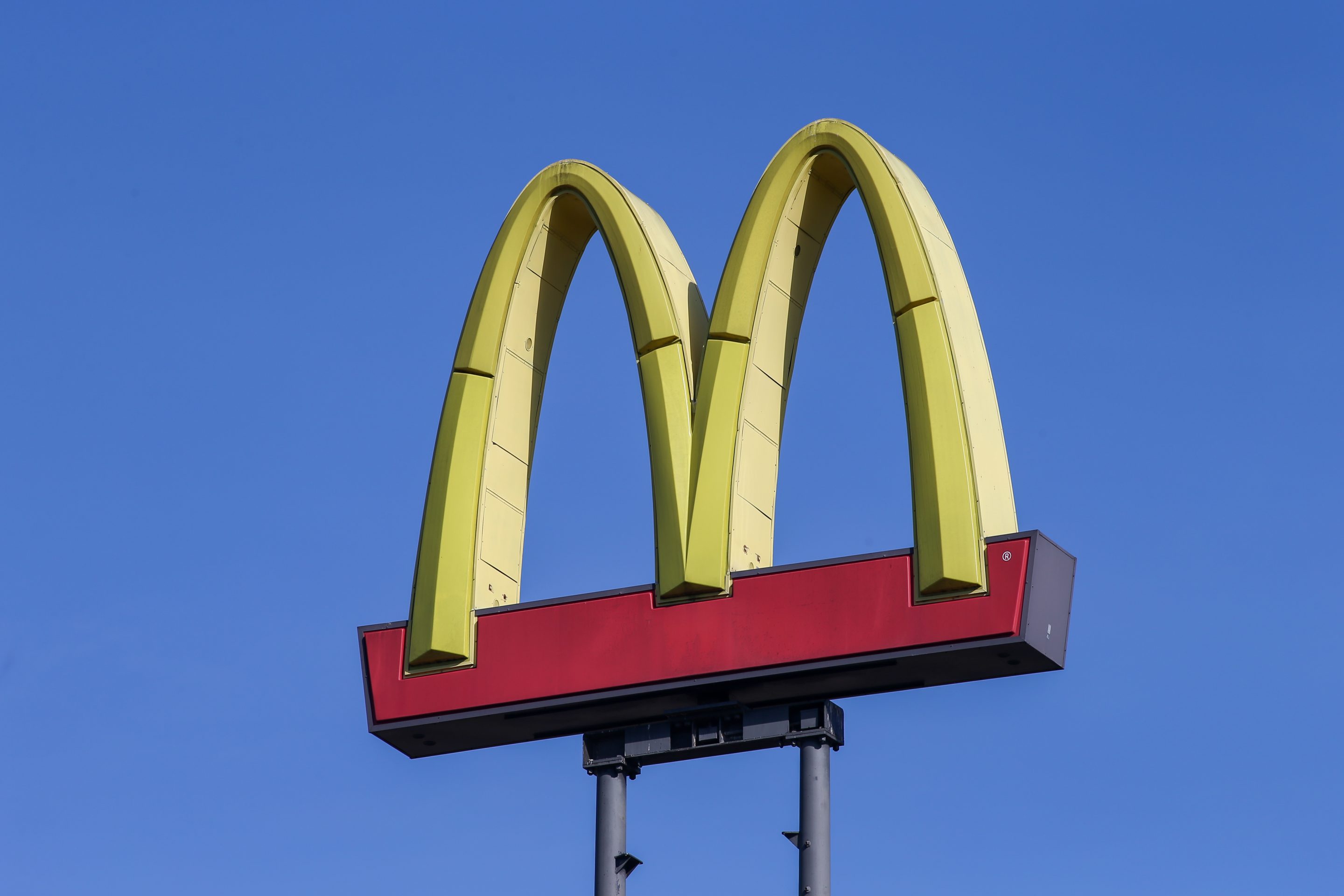 A McDonald's logo is seen on a sign at the fast food