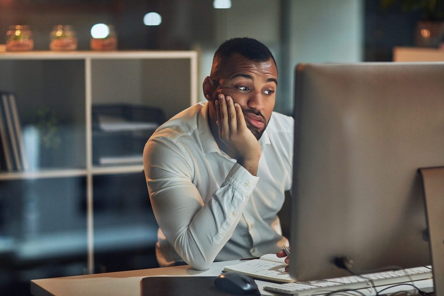 Bored businessman working late