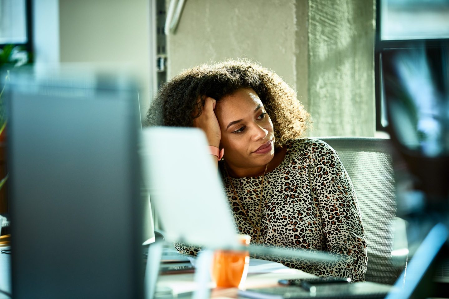 Woman stressed at laptop