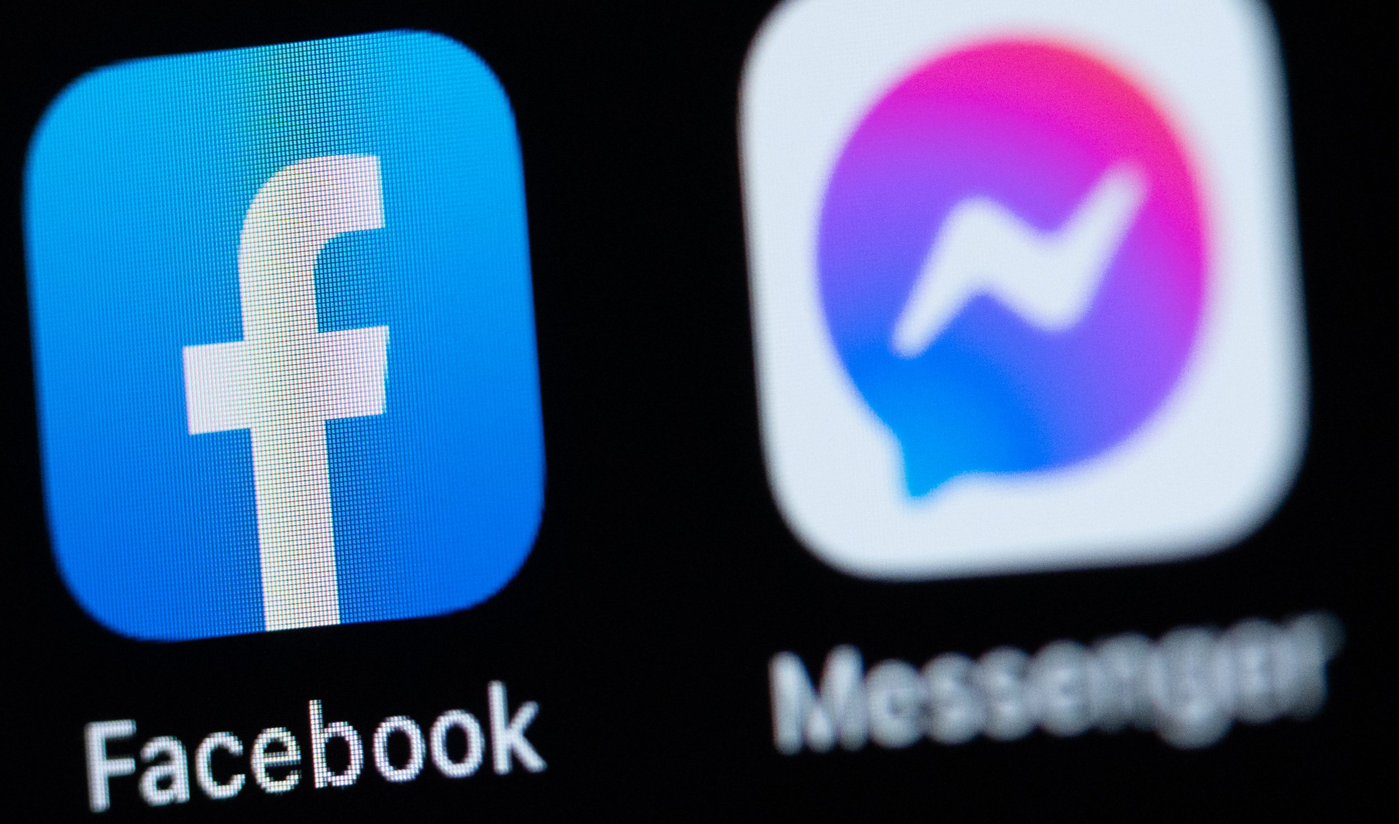 The application apps Facebook and Messenger is seen on the display of an iPhone.