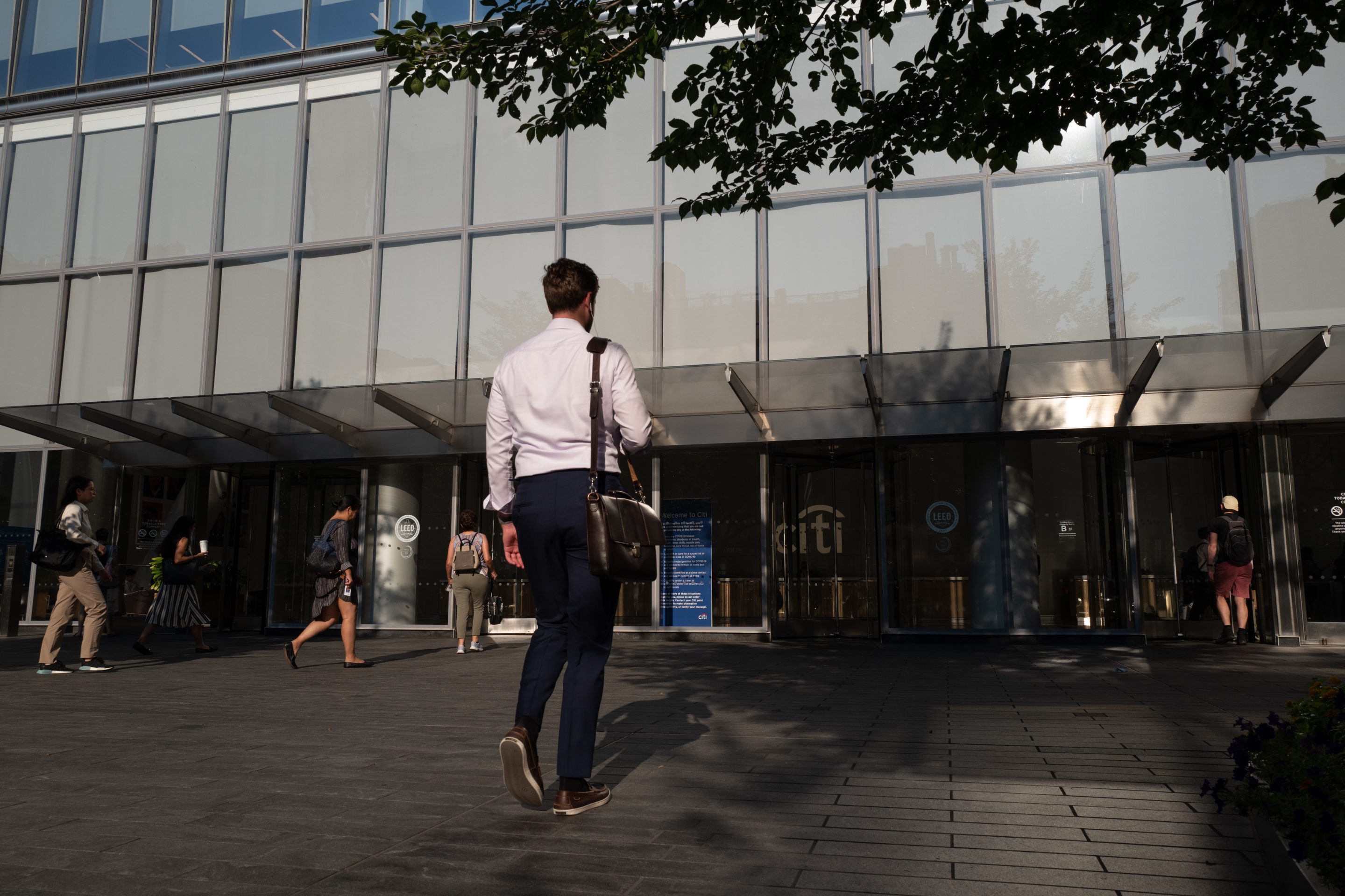 Man walking into Citi.