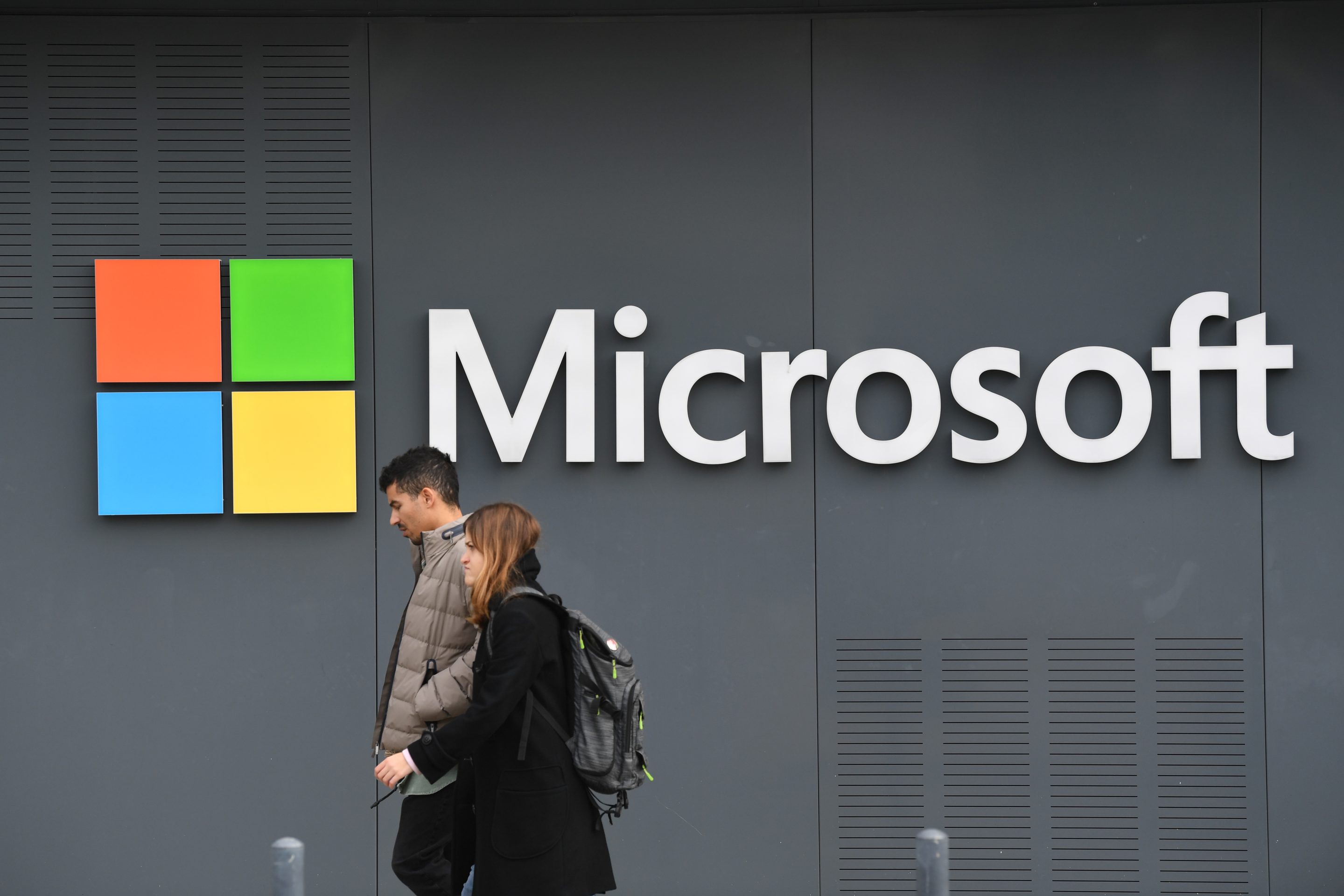 a Microsoft logo on the side of an office building