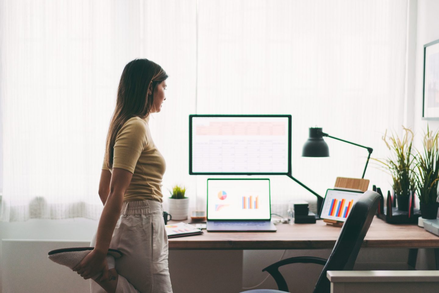 Woman stretching at computer
