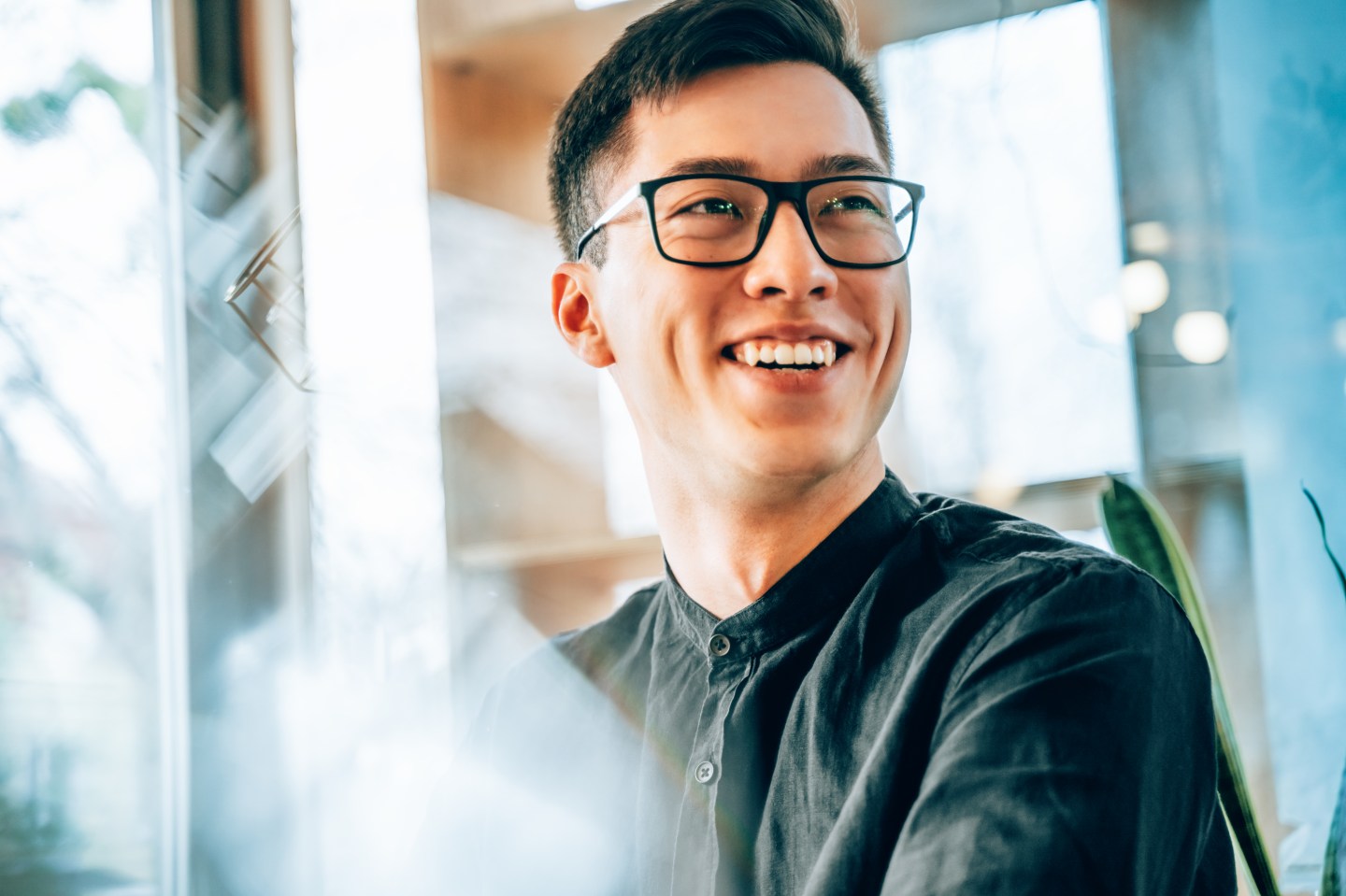 Photo of a young man wearing glasses.