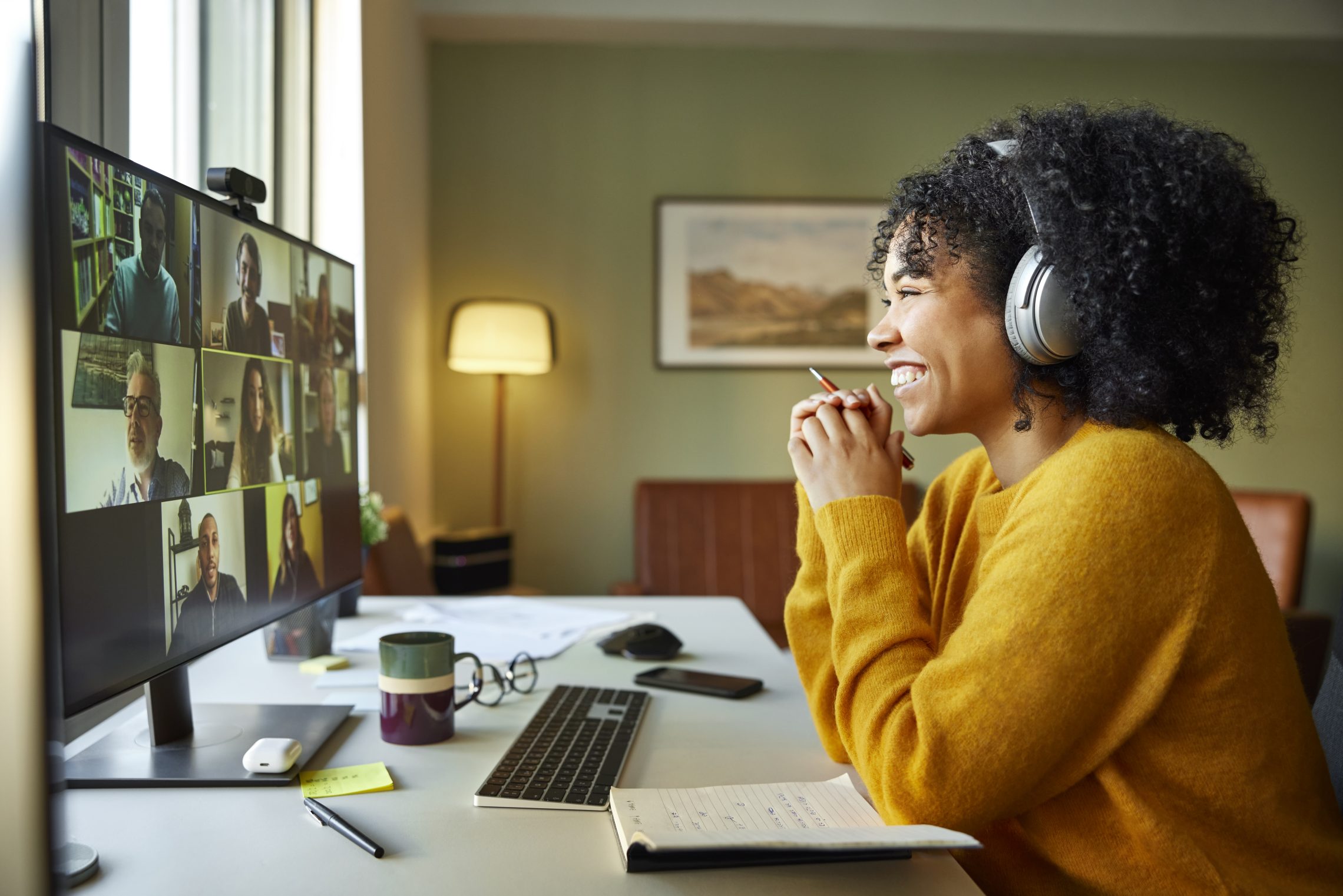 Woman working from home with headphone on