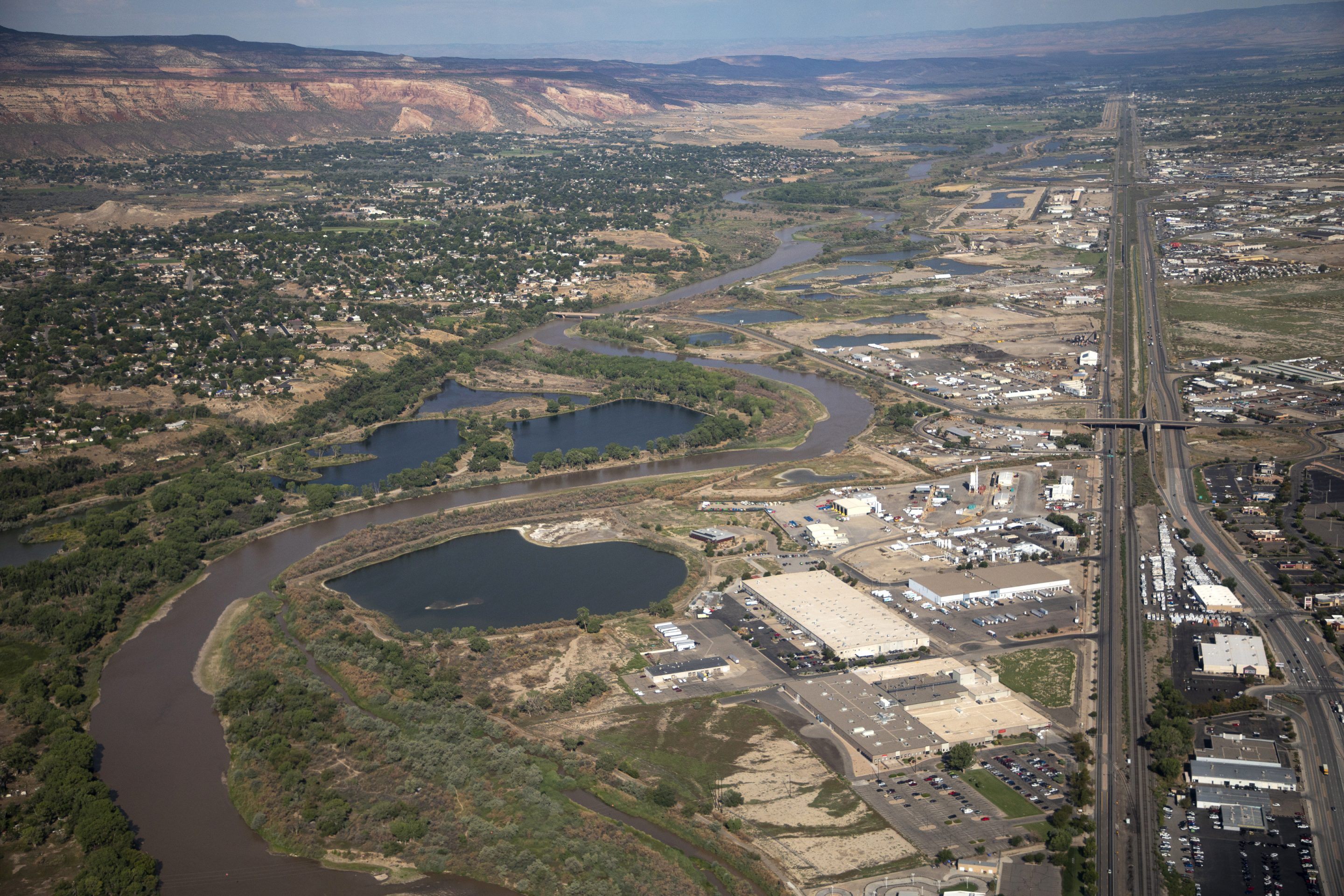 The Colorado River passes through Grand Junction, Aug. 24, 2022, in Mesa County, Colo.