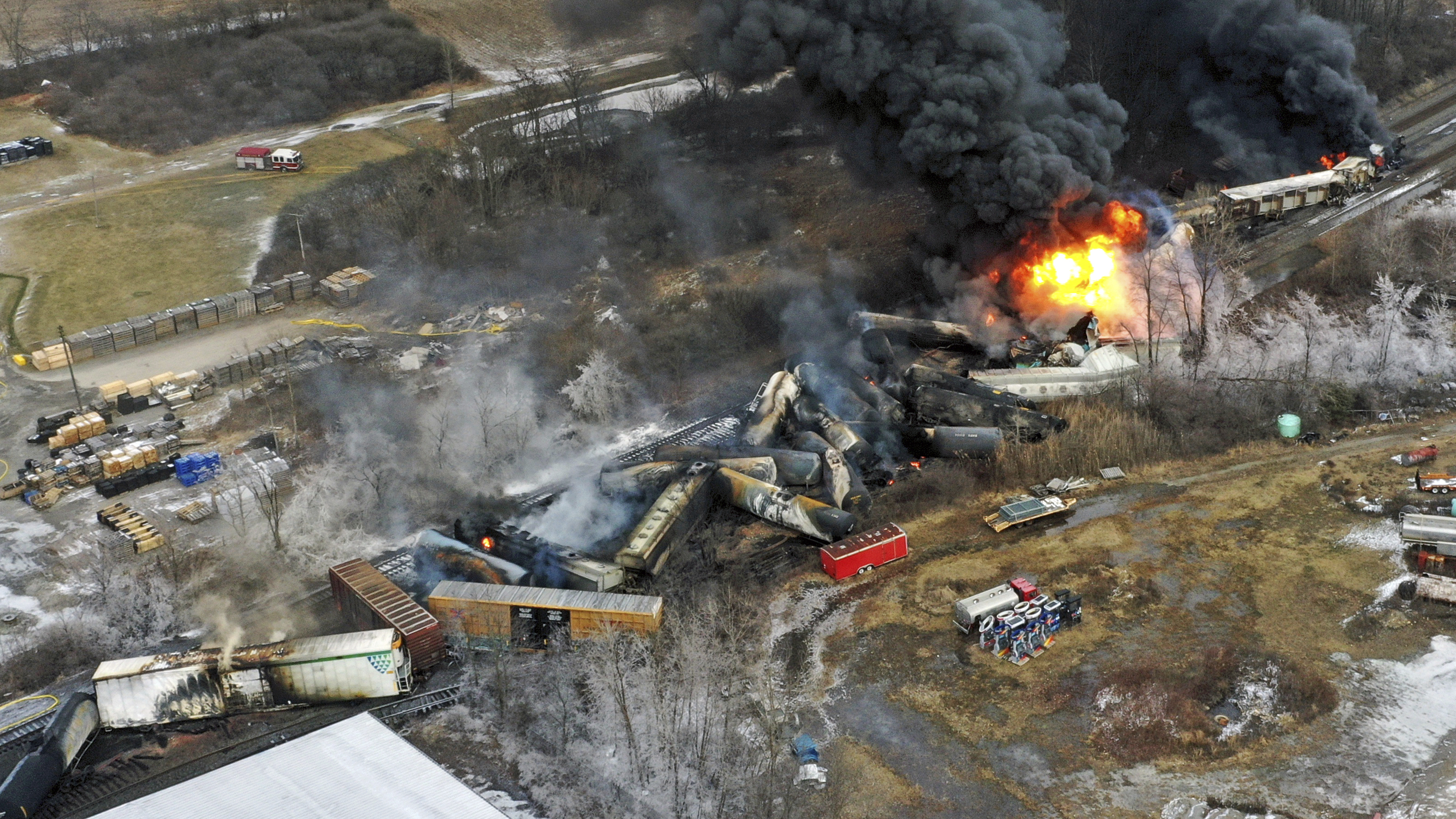 In this photo taken with a drone, portions of a Norfolk Southern freight train that derailed the previous night in East Palestine, Ohio, remain on fire at mid-day on Feb. 4, 2023.